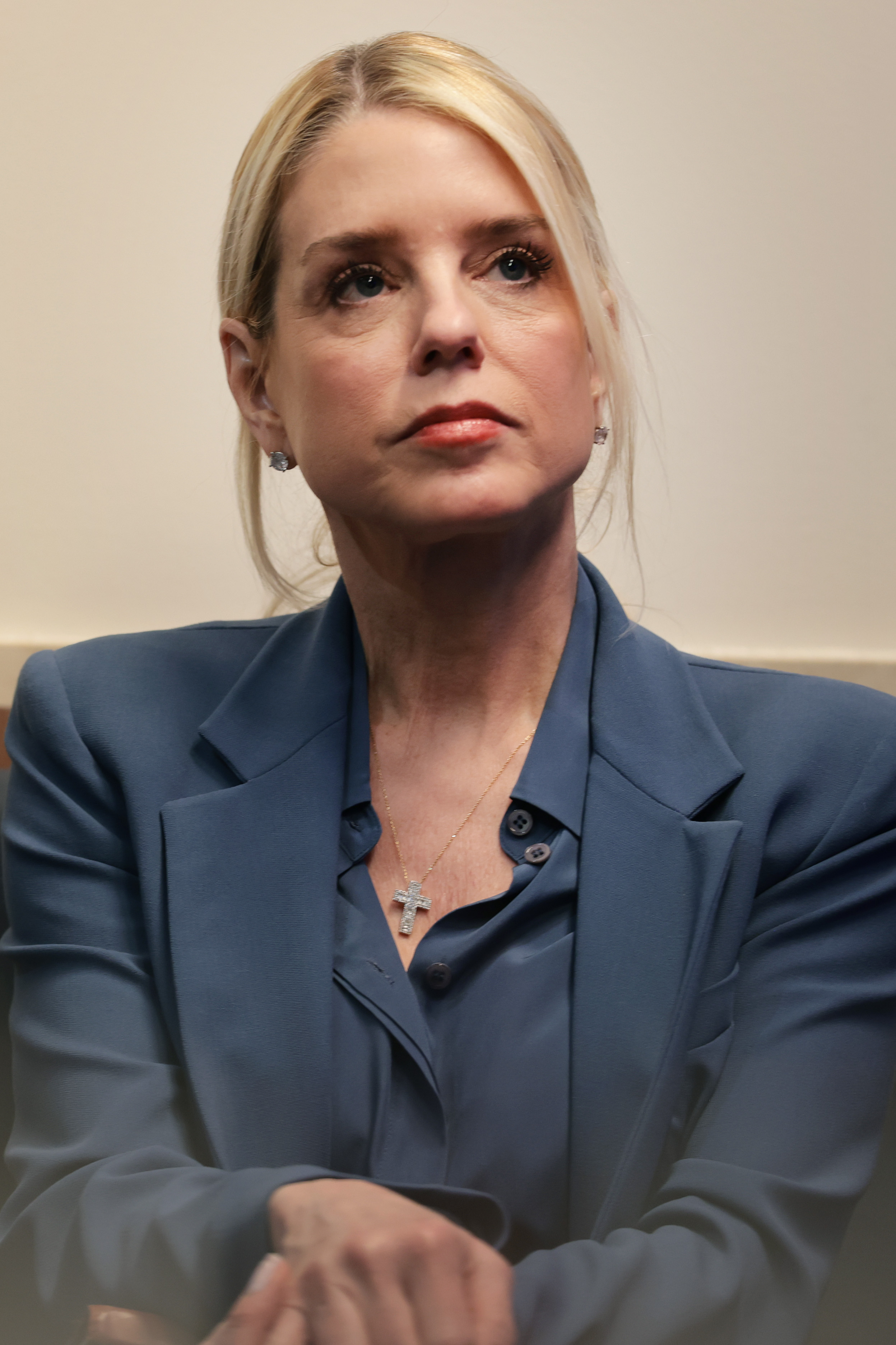 Pam Bondi listens as President Donald Trump speaks during a press briefing at the White House in Washington, D.C., on February 20, 2026 | Source: Getty Images