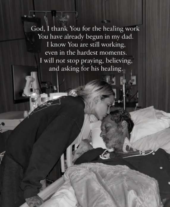 Thomas kisses Duguay's forehead in a quiet moment beside his hospital bed, six days after her earlier appeal for prayers. Her message expressed her family's determination to keep believing in his recovery as they faced each day together. | Source: Instagram/mrs__shay