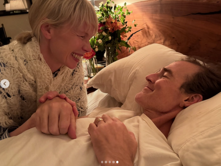 James Van Der Beek shares a quiet smile as he lies in bed, holding hands with Erin Fetherston in an intimate final moment | Source: Instagram/erinfetherston