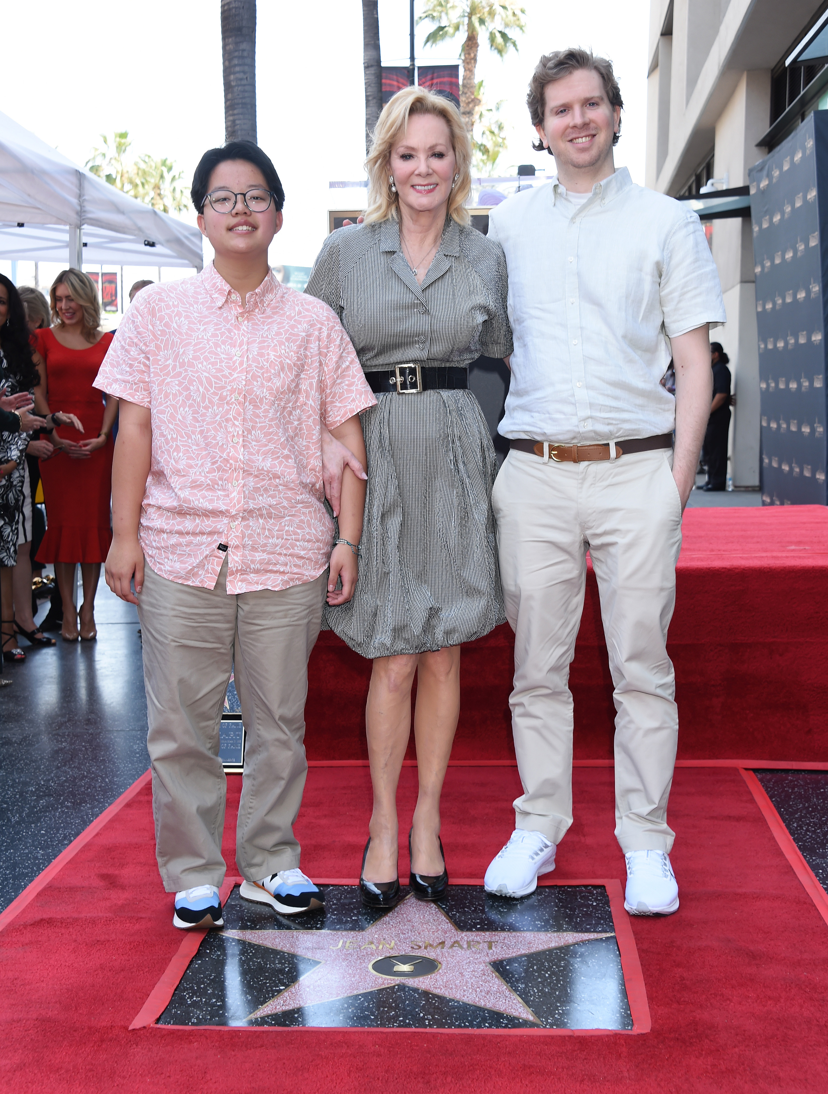 Jean Smart poses with her sons, Forrest Kathleen Gilliland and Connor Douglas Gilliland, at the ceremony honoring her with a star on the Hollywood Walk of Fame in Los Angeles, California. The family moment came as Jean continued to navigate life after the death of her late husband, actor Richard Gilliland, whose support she credited as an important part of her career. | Source: Getty Images