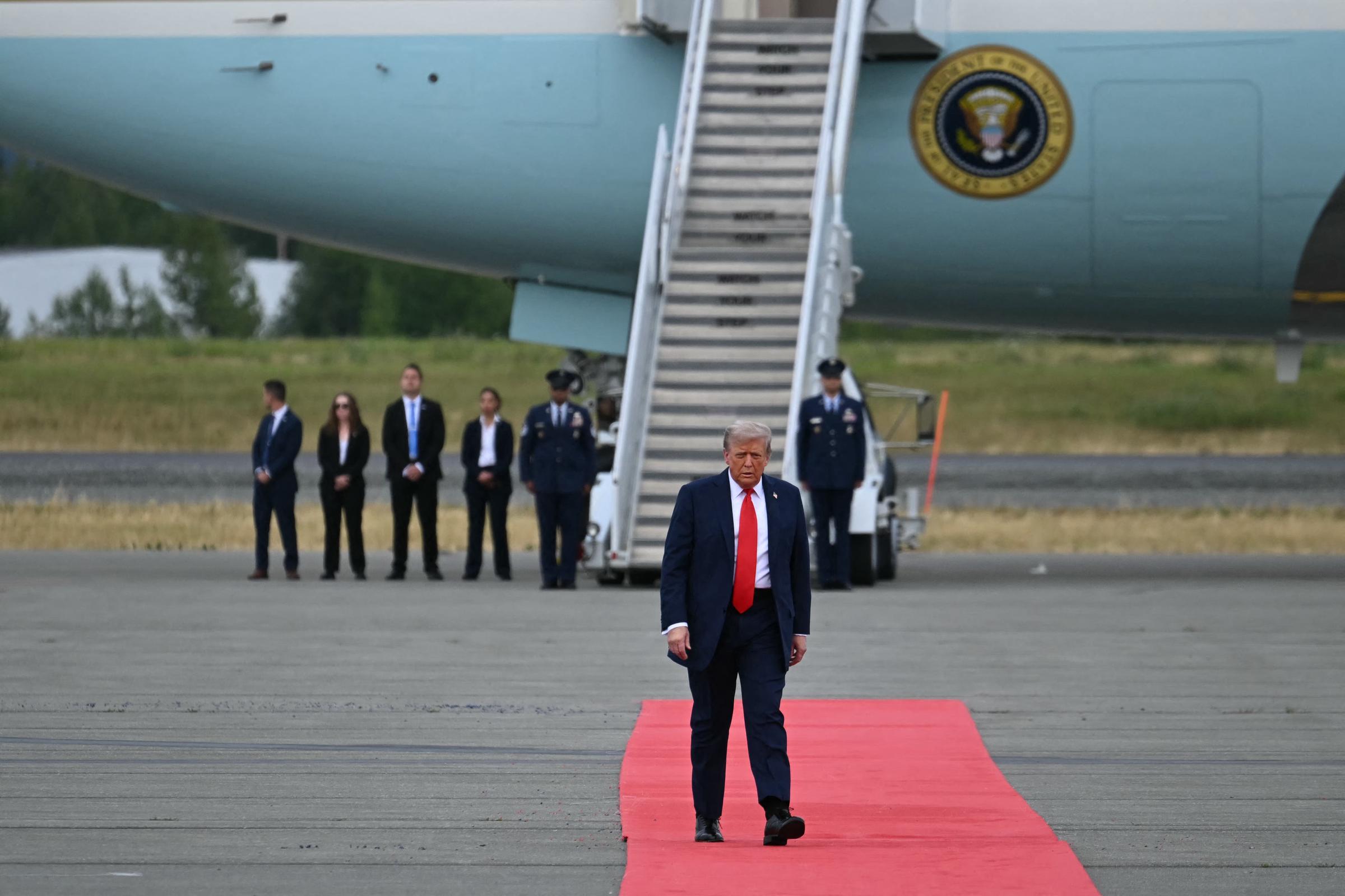 Donald Trump walks on the red carpet before greeting Vladimir Putin at Joint Base Elmendorf-Richardson in Anchorage, Alaska, on August 15, 2025 | Source: Getty Images