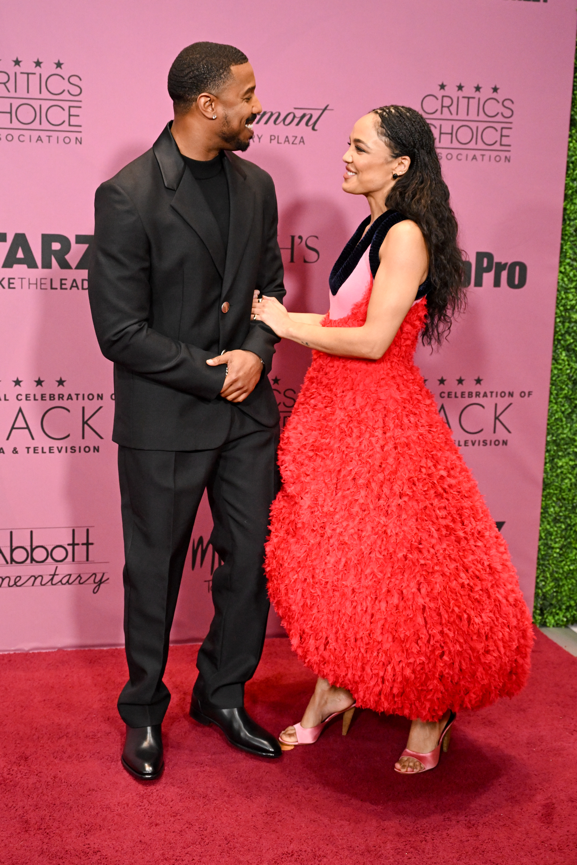 Michael B. Jordan and Tessa Thompson sharing a moment on the red carpet. | Source: Getty Images