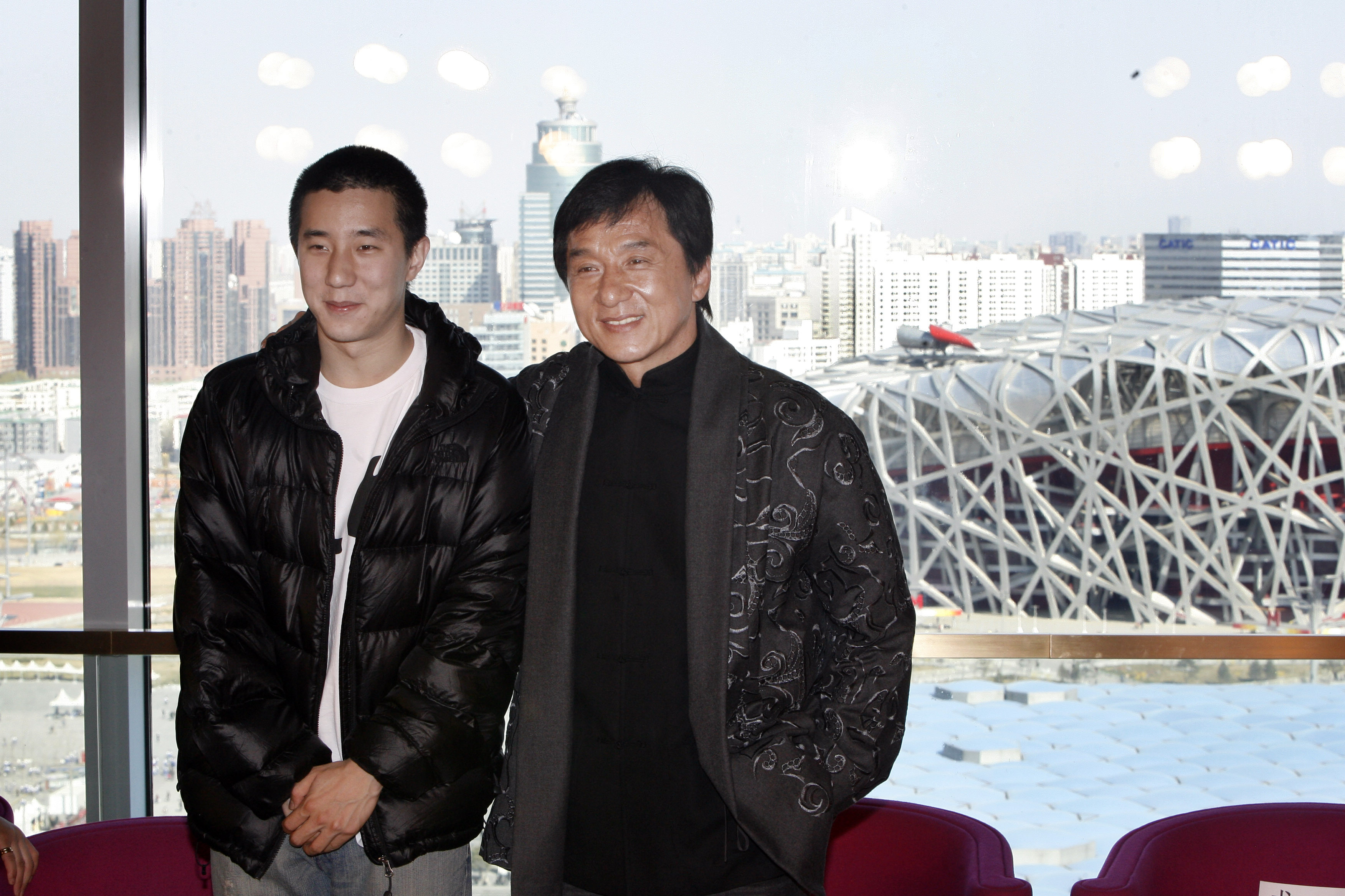 Jaycee and Jackie Chan at a press conference announcing a concert at the Bird's Nest Stadium on April 1, 2009, in Beijing, China. | Source: Getty Images