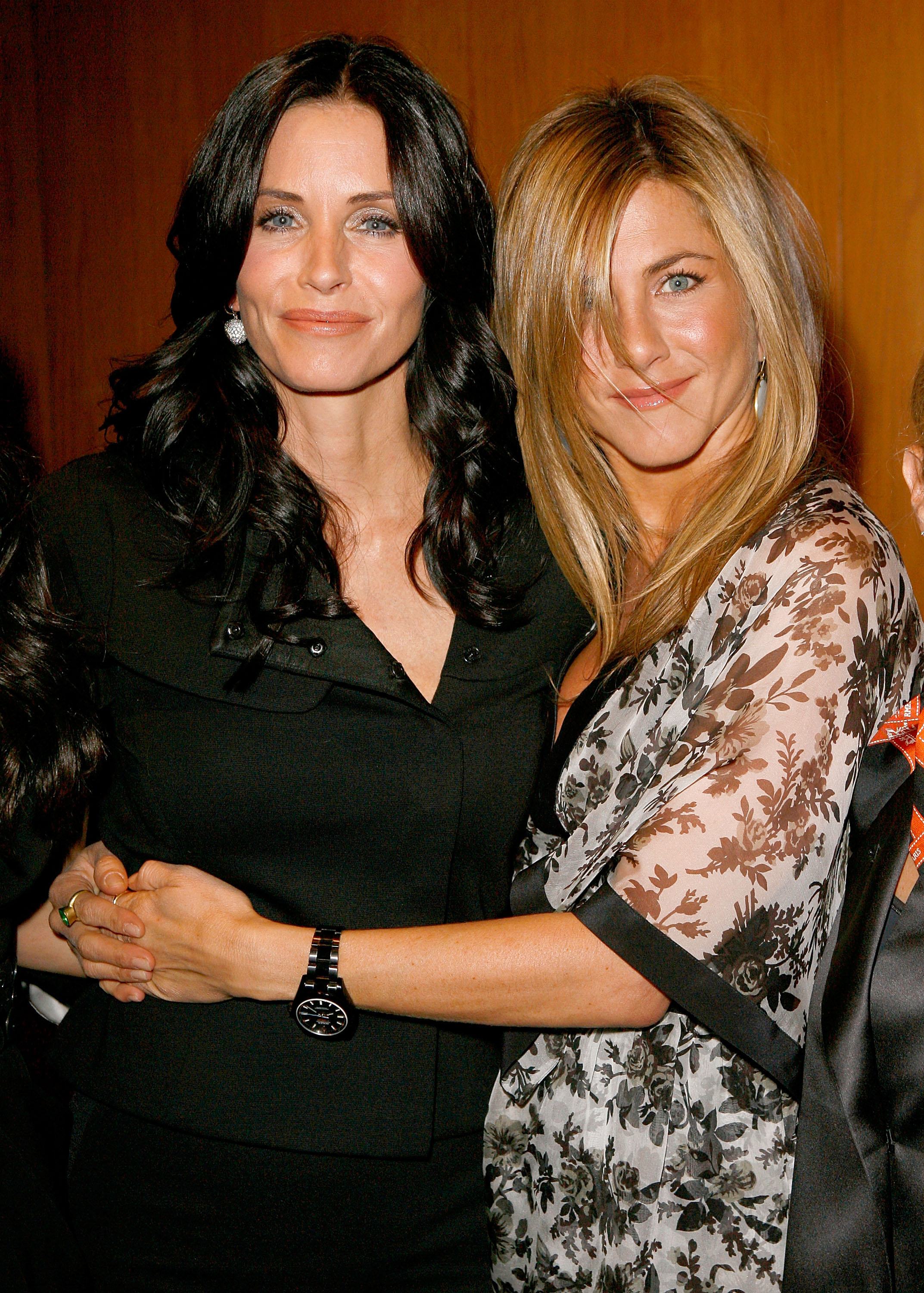 Courteney Cox and Jennifer Aniston at the premiere of "Glamour Reel Moments" presented by Suave, held at the Directors Guild of America in Los Angeles, California. Both shine in flawless makeup, though their facial differences are more noticeable, with Cox’s cheeks appearing fuller.