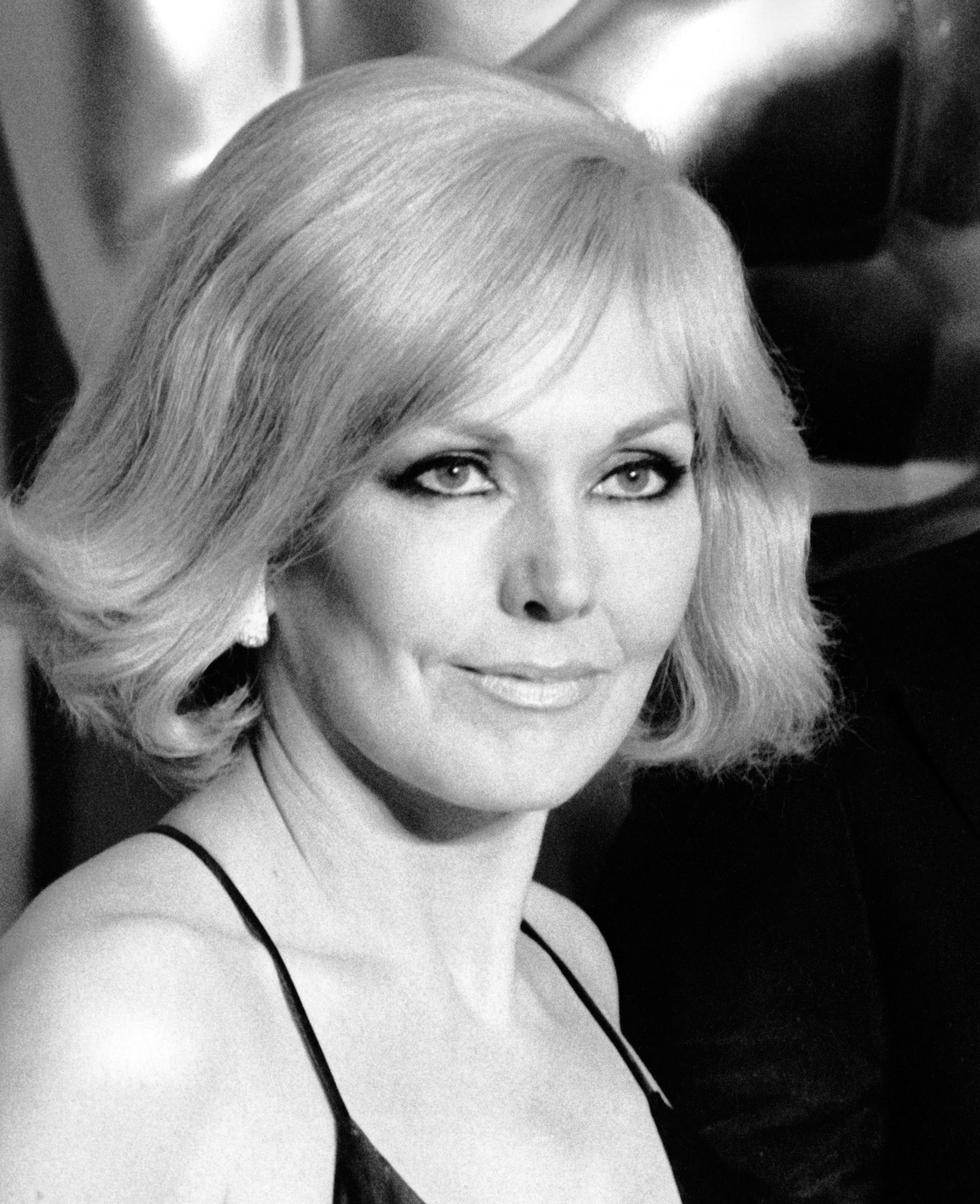 Kim Novak attends the 51st Annual Academy Awards at the Dorothy Chandler Pavilion in Los Angeles, wearing a black evening dress with thin straps. | Source: Getty Images