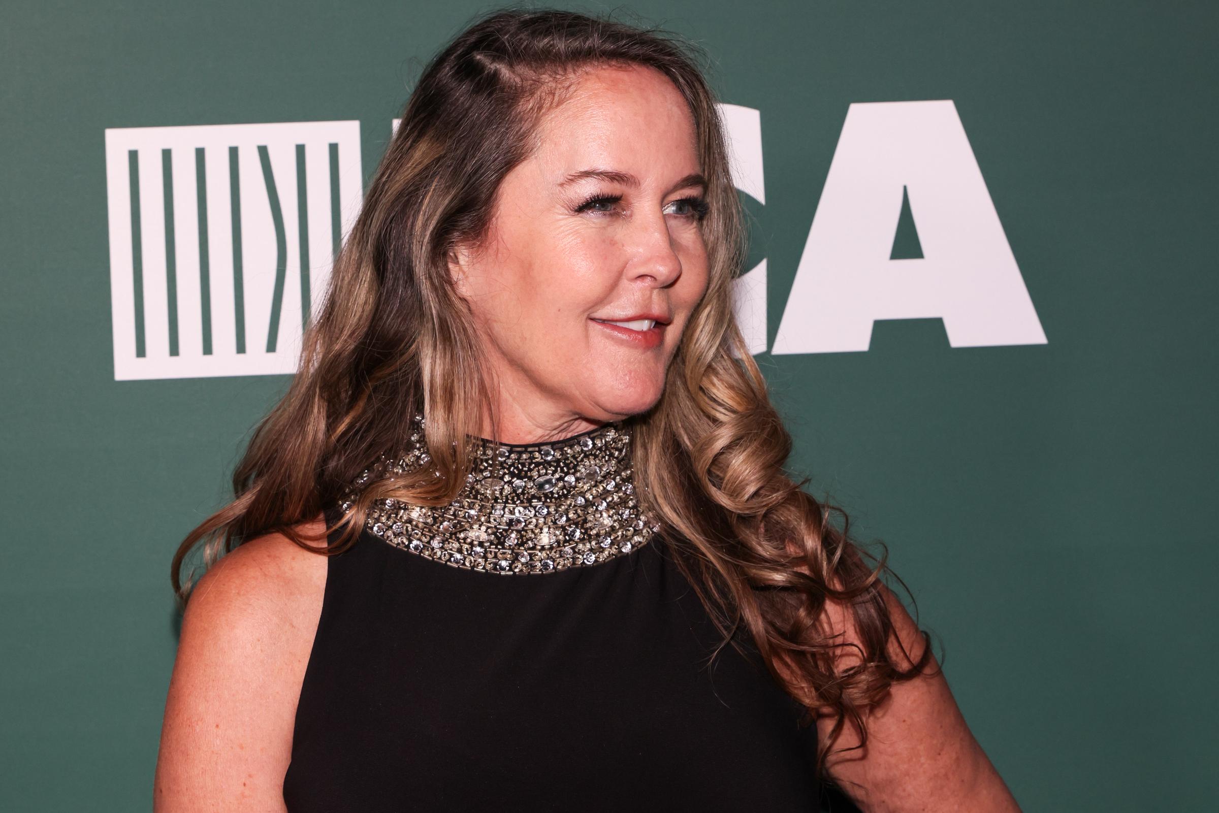 At the Last Chance for Animals Anniversary Gala, Murphy wore a black sleeveless dress with a heavily embellished neckline and long curled hair. The close-up gives a clear view of how her styling continued to evolve over the years.