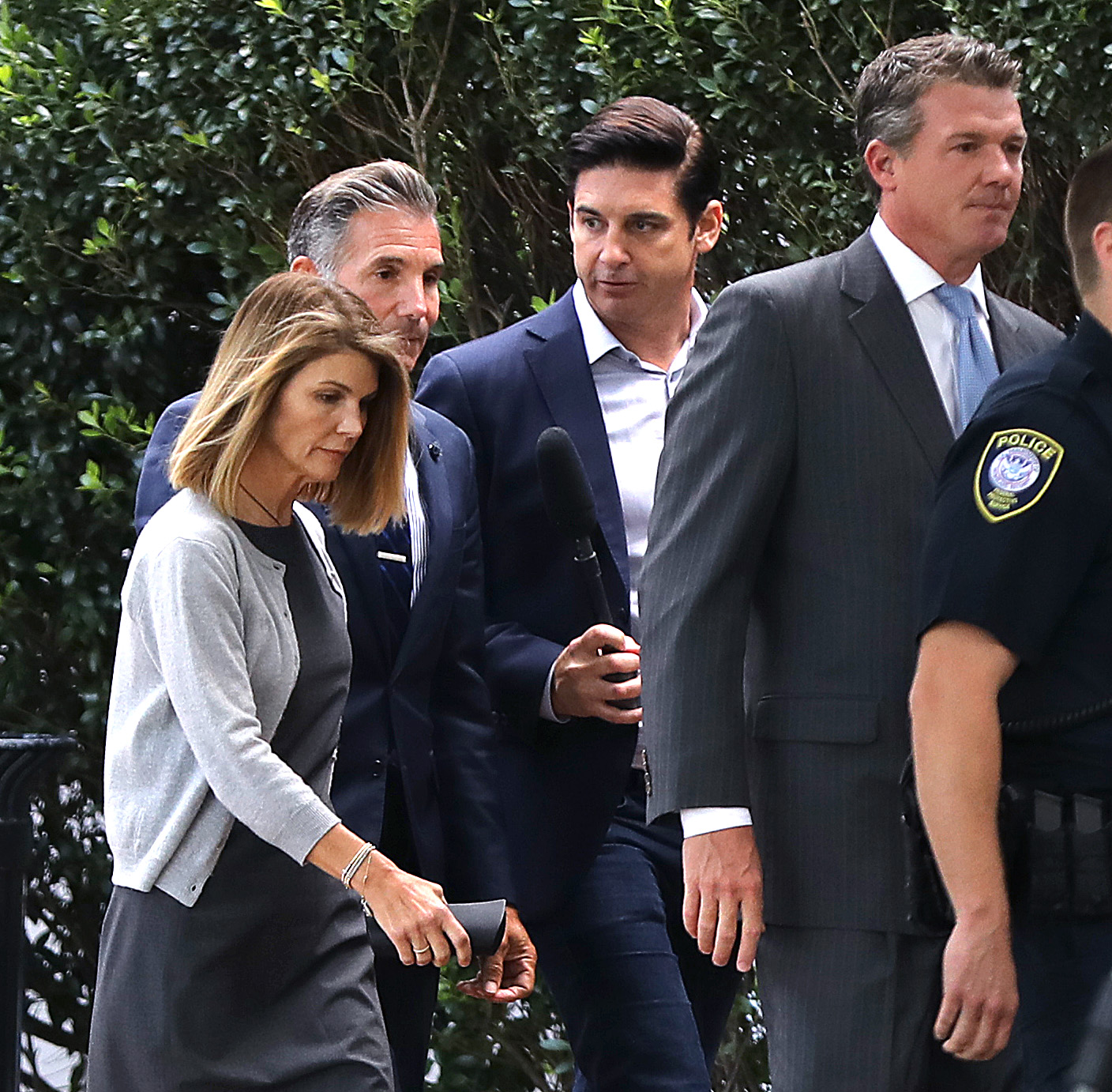 This image captures one of the most closely watched moments in the college admissions case involving Lori Loughlin and her husband, Mossimo Giannulli. Both later pleaded guilty and served prison sentences before Loughlin resumed acting in the years that followed. | Source: Getty Images