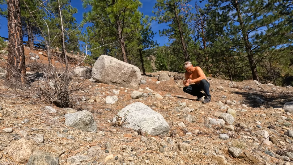Matt Brown seen shirtless among trees and rocks in his final YouTube video post, posted on February 3, 2026. | Source: YouTube/Matt Brown