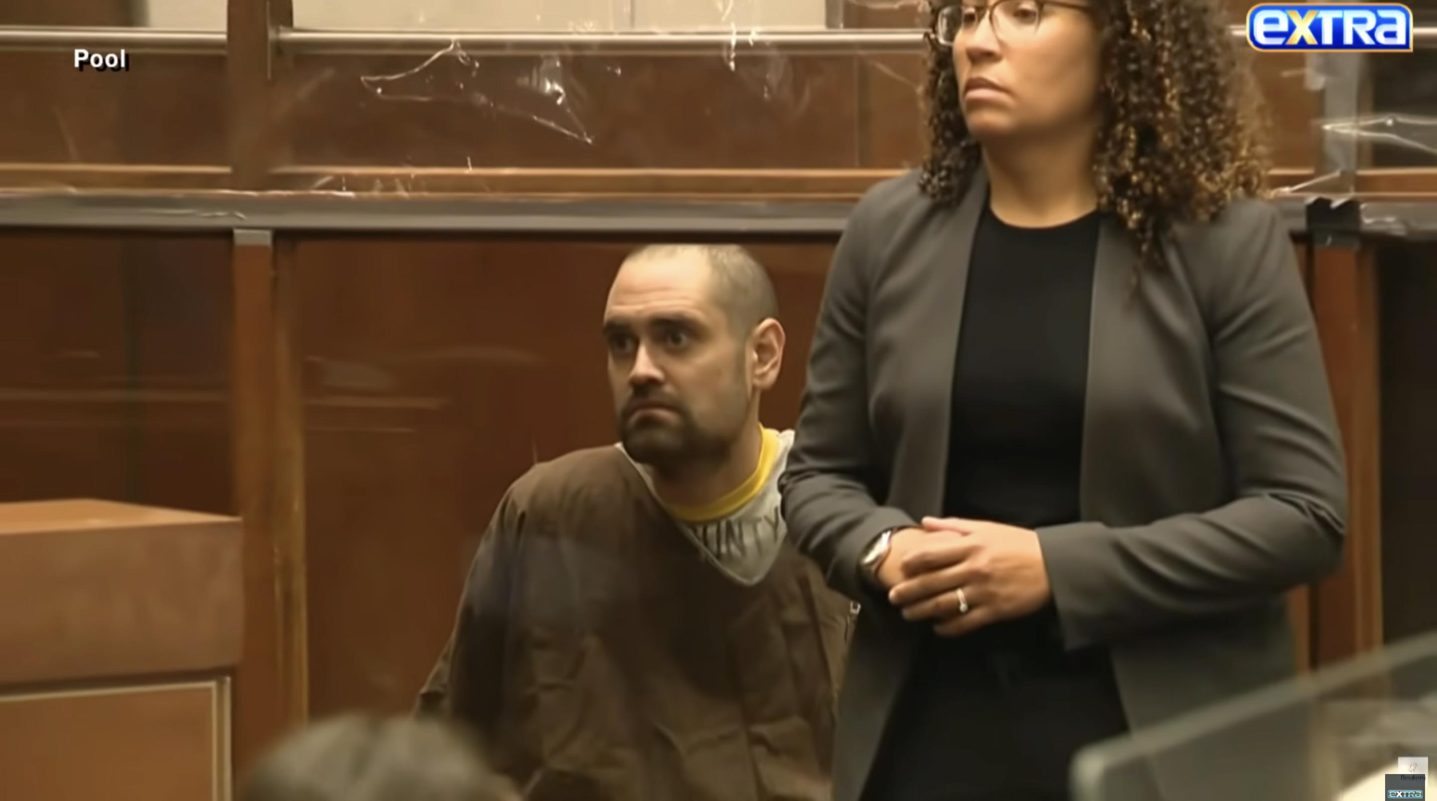 Nick Reiner looks upward while seated in court, his expression tense as proceedings unfold | Source: YouTube/ExtraTV