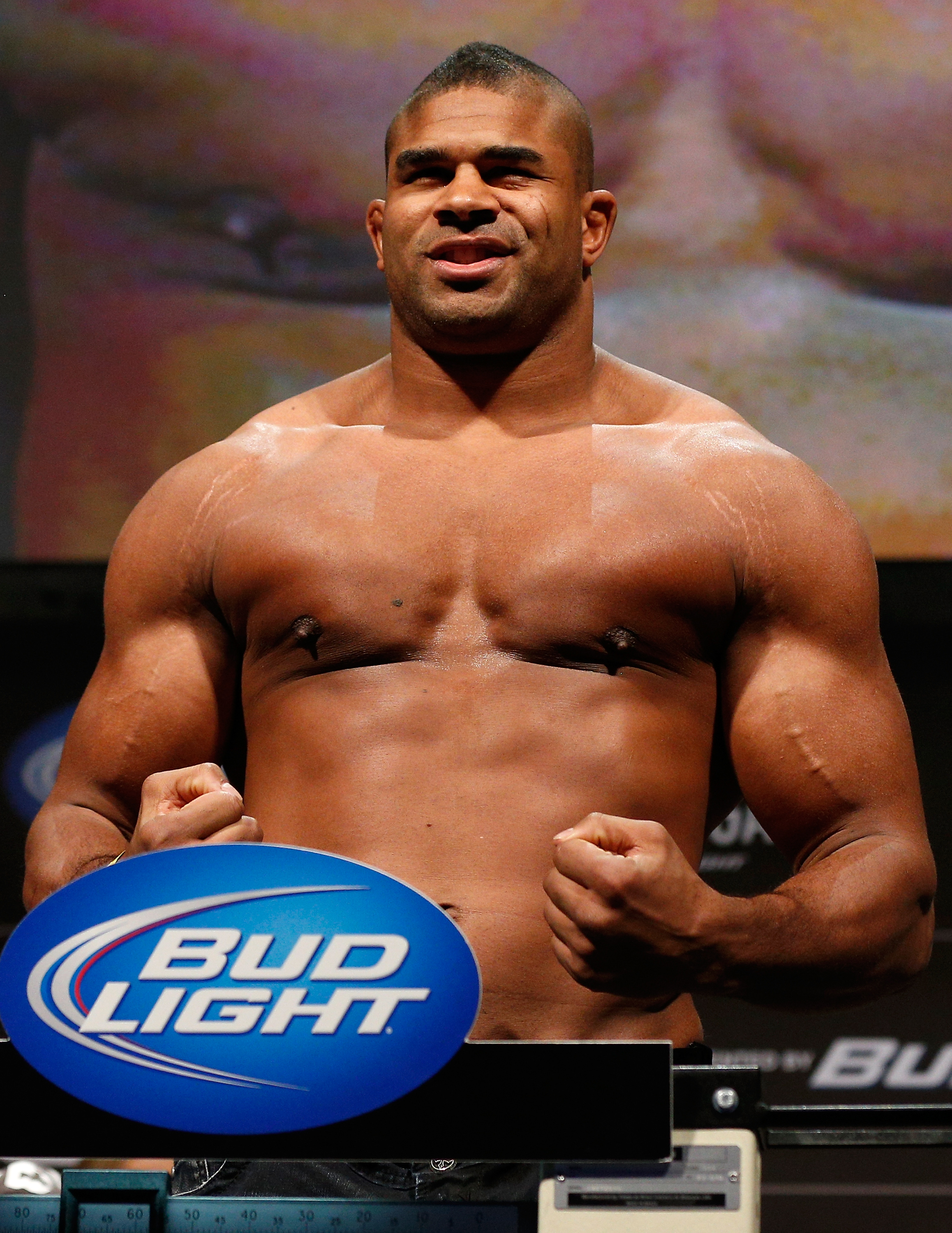 Alistair Overeem's formidable heavyweight frame remained on full display as he stepped onto the scale for the UFC 156 weigh-in at the Mandalay Bay Events Center in Las Vegas, Nevada, on February 1, 2013. Bare-chested and flexing for the crowd, Overeem showed the considerable size he carried into competition during this period. The appearance stands in sharp contrast to the significantly slimmer figure that would capture attention following his later dietary and lifestyle changes.