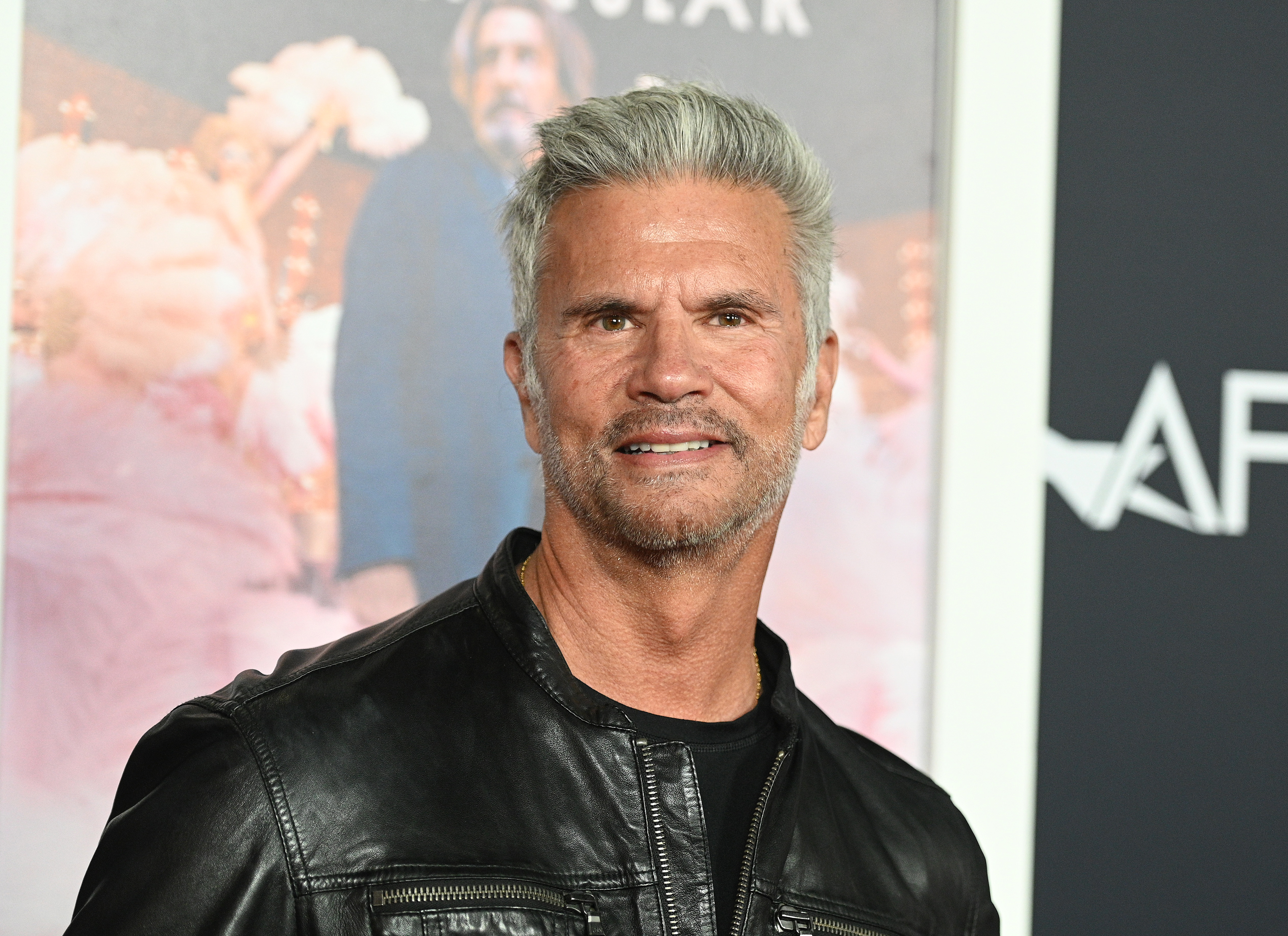 Decades after his rise as a dark-haired television heartthrob, Lorenzo Lamas stepped out with a noticeably different look at AFI Fest in Los Angeles. Attending a screening of "Bardo, False Chronicle of a Handful of Truths" on November 3, 2022, the actor wore his gray hair swept back and paired a neatly trimmed beard with a black leather jacket, reflecting his appearance later in life.