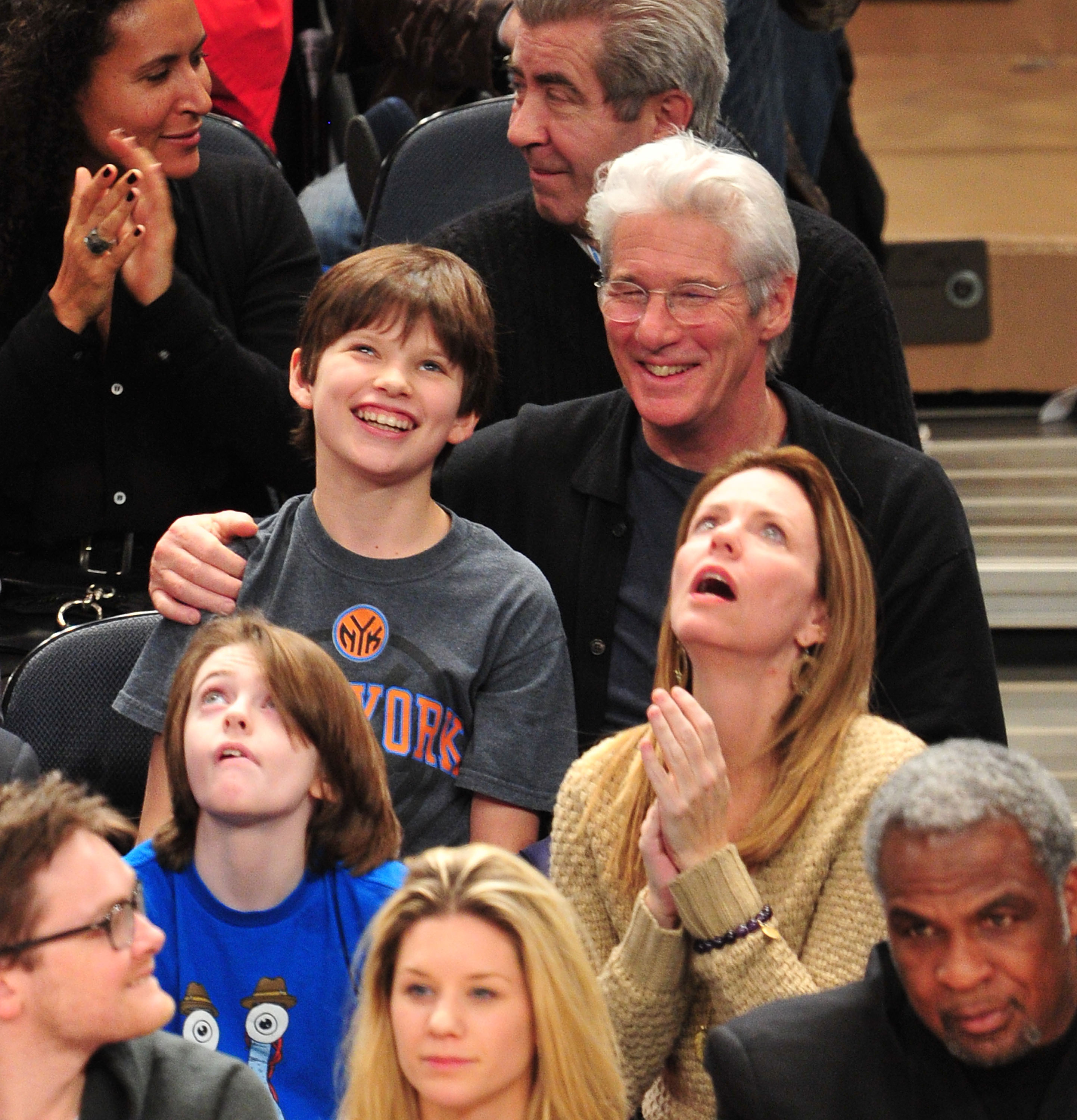 Homer James Jigme Gere and Richard Gere attend the Chicago Bulls vs. New York Knicks game at Madison Square Garden in New York City.