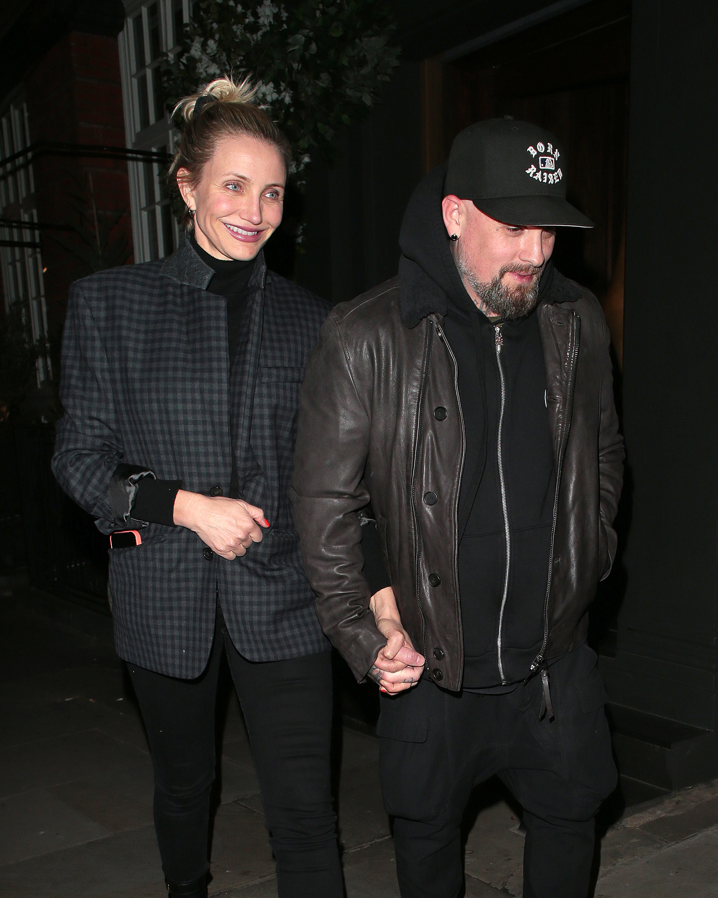 On December 2, Cameron Diaz and Benji Madden were spotted leaving Sparrow Italia in London’s exclusive Mayfair district. Bundled up against the winter chill, Diaz wore a checked blazer and black turtleneck while Madden kept to his trademark dark layers and baseball cap. Smiling as she clutched her husband's hand, Diaz looked relaxed on the rare transatlantic date night.