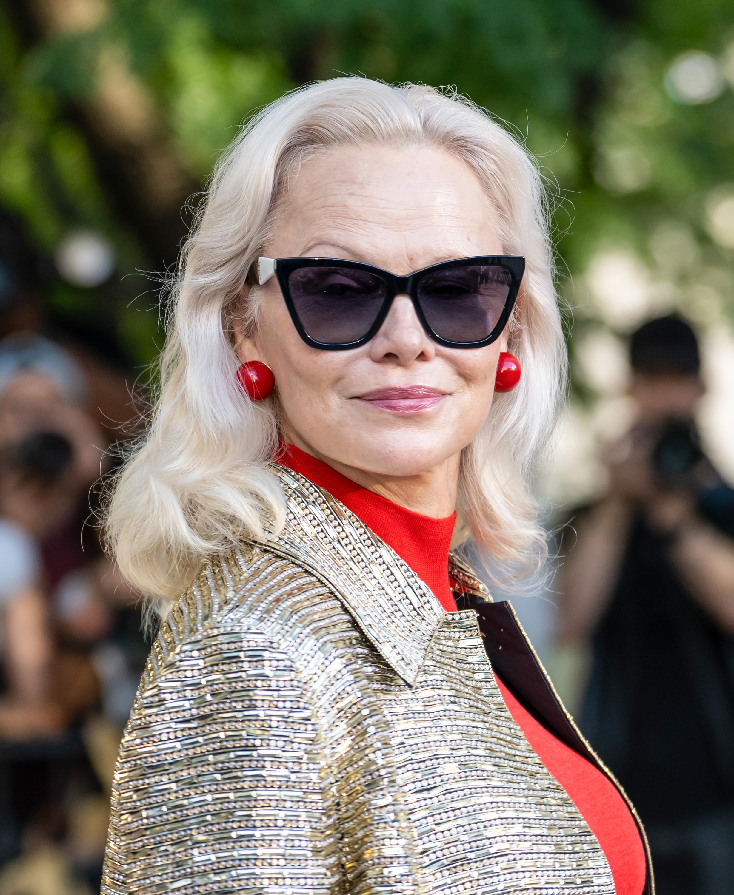 Pamela Anderson continues to embrace her signature platinum blonde, pairing it with a more natural beauty look after stepping away from the heavy makeup that defined her Baywatch years. | Source: Getty Images