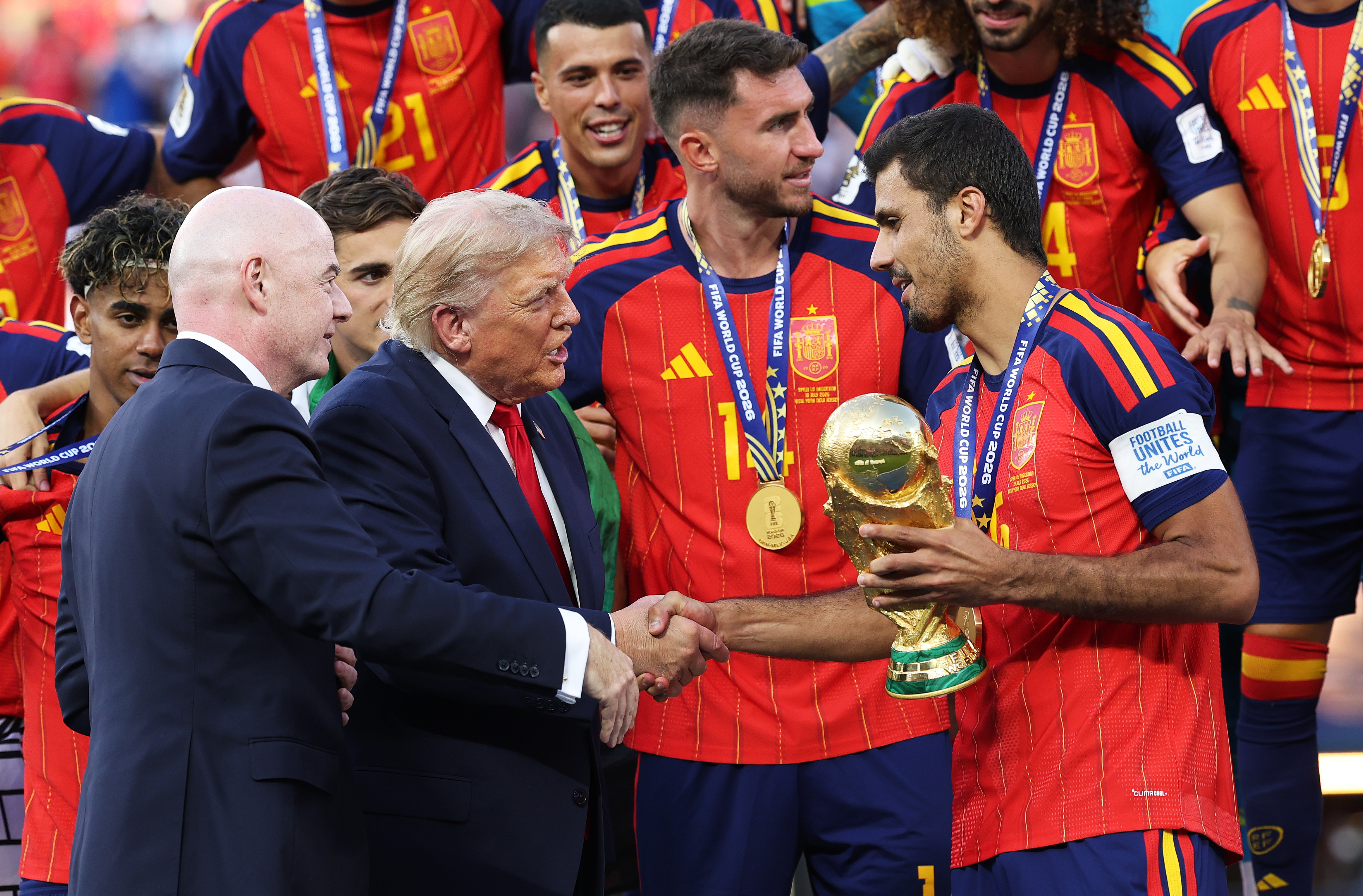 Spain's victory ceremony placed political figures and football officials directly alongside the newly crowned champions. Donald Trump's extended interaction with the players soon became part of the viral conversation surrounding the trophy presentation. | Source: Getty Images
