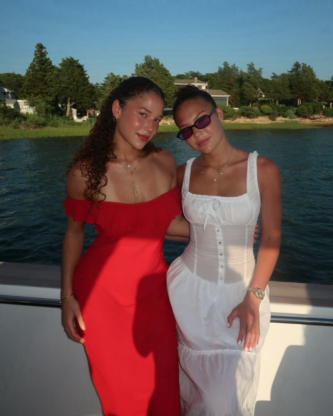 Isabella and Sophia Strahan pose together by the waterfront, showing off their individual styles as they celebrate another milestone. | Source: Instagram/michaelstrahan