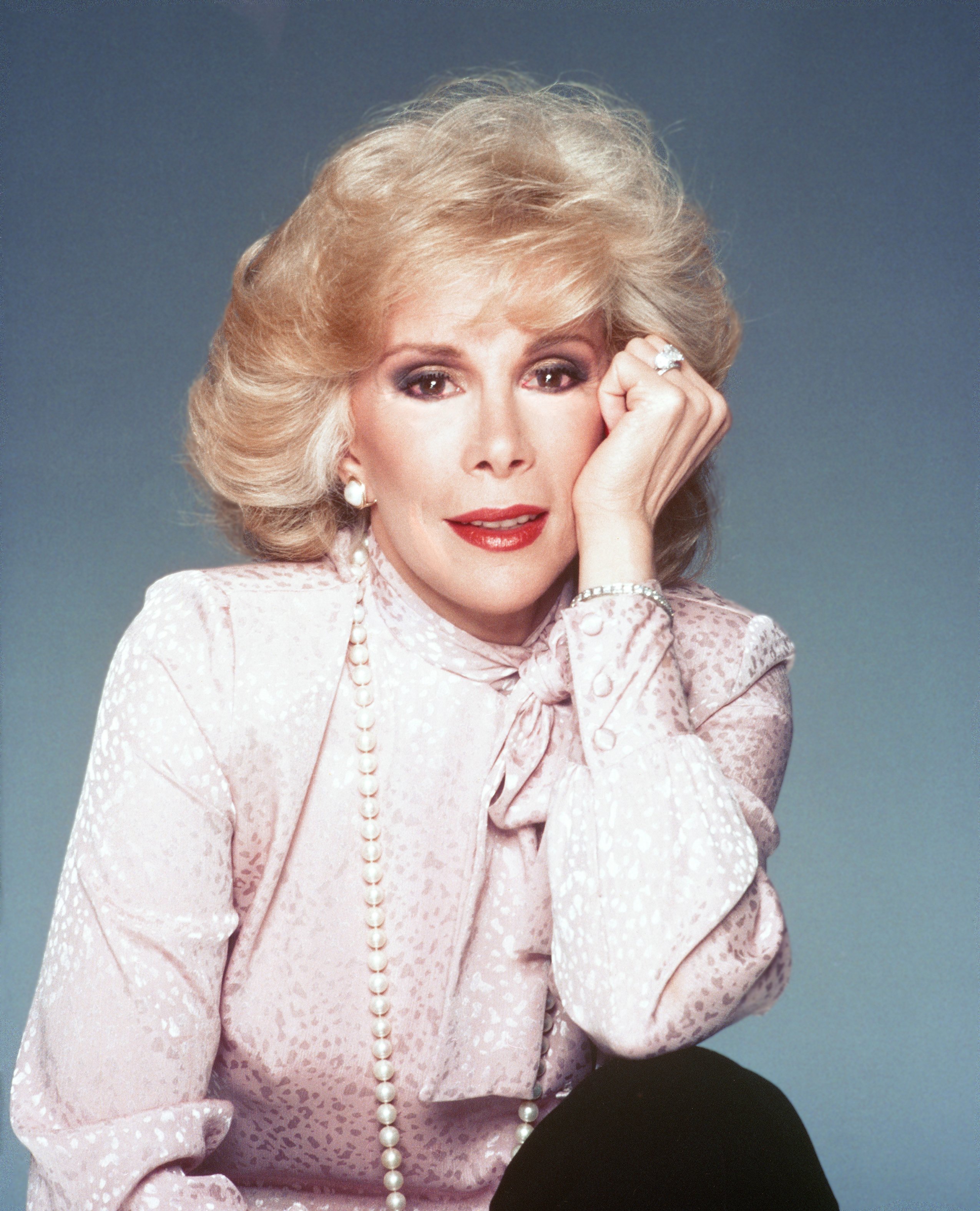 Joan Rivers poses for a portrait in Los Angeles in 1987, as photos from across the decades documented her changing appearance alongside her expanding television career. | Source: Getty Images