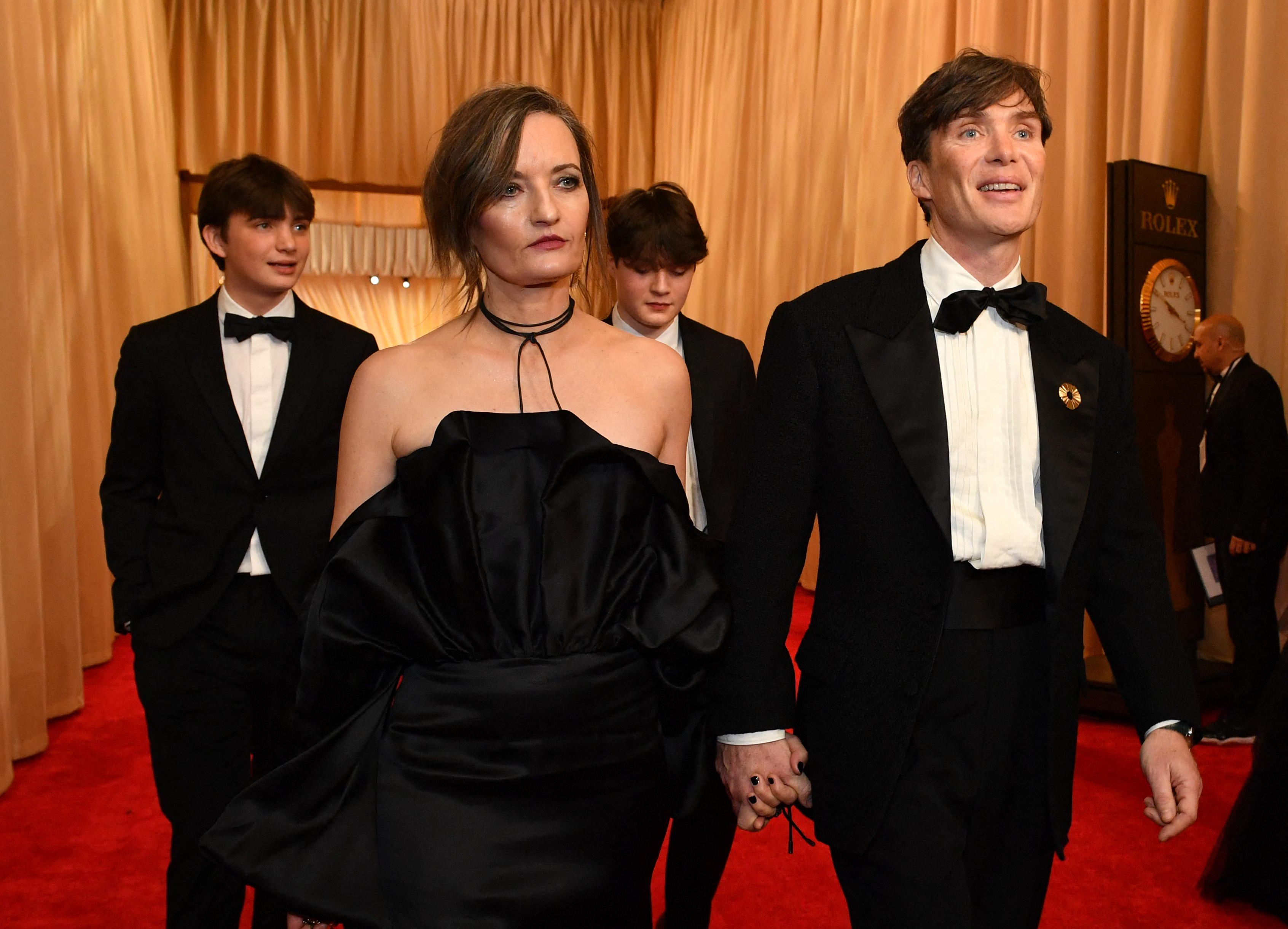 Cillian Murphy and his wife, Yvonne McGuinness, arrived at the 96th Annual Academy Awards at the Dolby Theatre in Hollywood, California, on March 10, 2024, accompanied by their sons, Malachy Murphy and Aran Murphy. The rare family appearance on the red carpet offered a glimpse of the famously private couple with their two sons, who have largely been kept out of the public eye throughout Cillian's career.