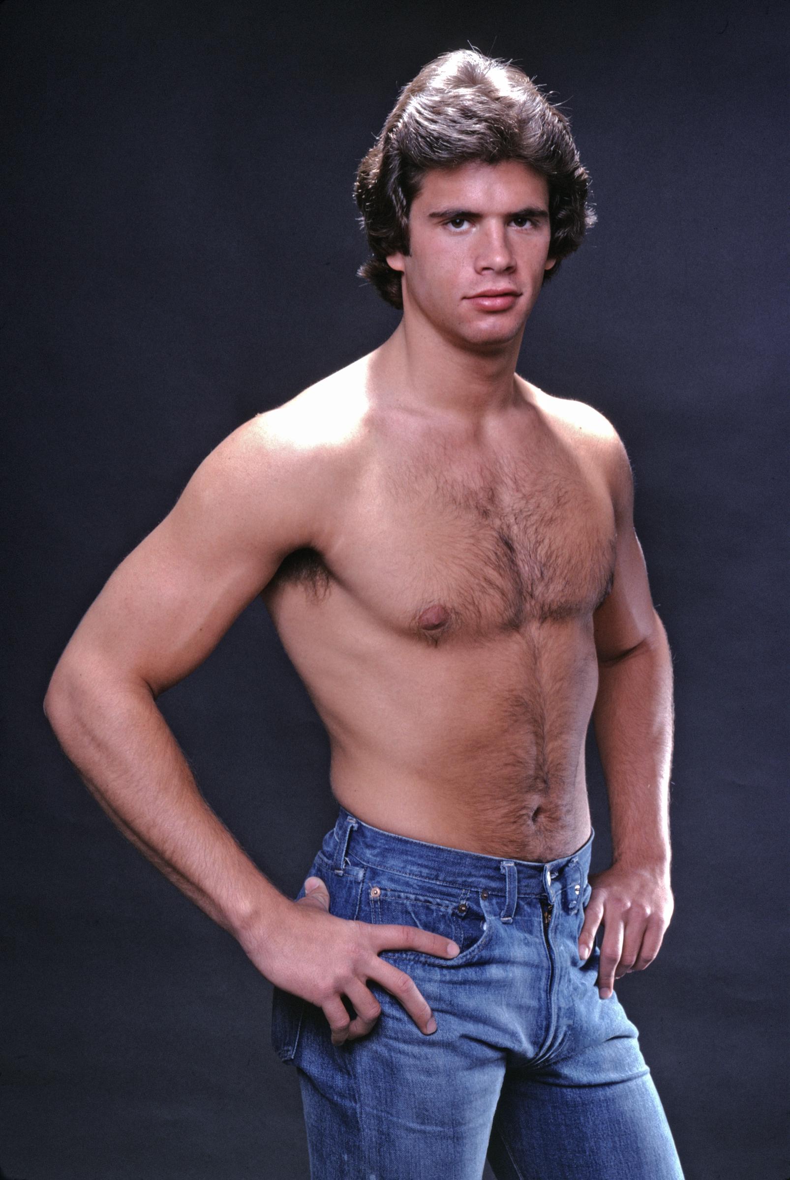 At 21 years old, Lorenzo Lamas displayed the youthful looks that would help shape his heartthrob image. Photographed in 1979, the young actor posed shirtless in blue jeans, with his thick brown hair framing his fresh-faced features. The portrait captured him early in his life in the spotlight, years before his career and personal life took several unexpected turns.