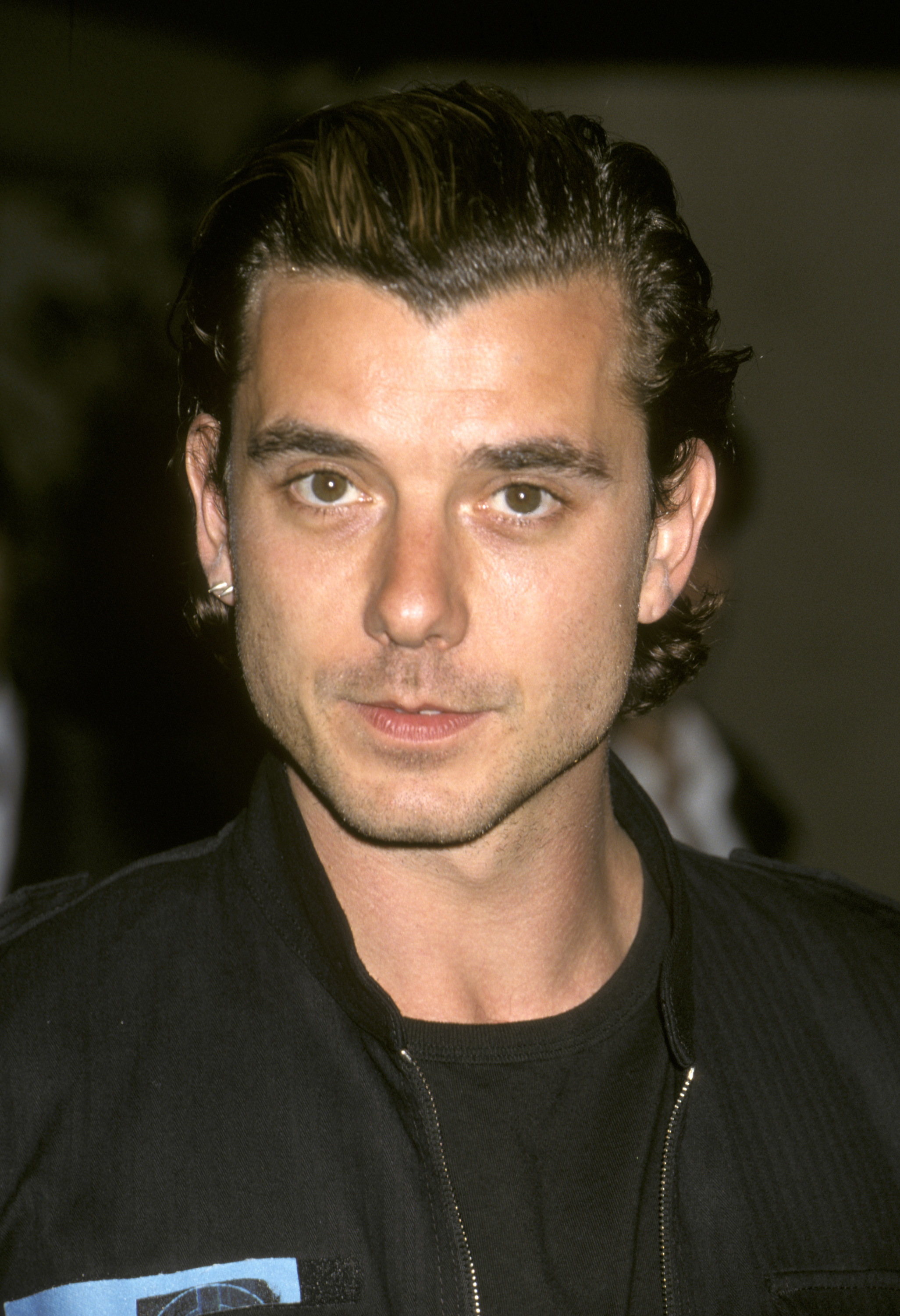 Gavin Rossdale of Bush faces the camera in a black jacket and slicked-back hair at the Seventh Annual Race to Erase MS Gala Dinner in Century City.