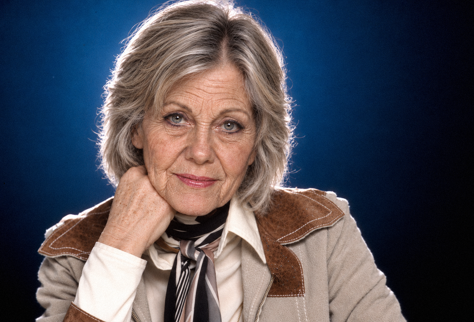 AI-generated impression. This final image imagines Olivia at 78 — the age she would have reached on September 26, 2026. Older, contemplative, and unmistakably inspired by the star fans remember, it offers a bittersweet visual interpretation of the birthday at the heart of this tribute. | Source: Chat GPT