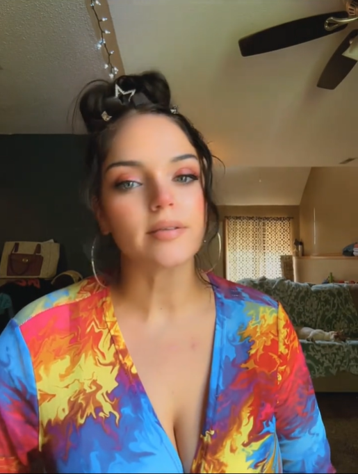 Autumn Urker is pictured in a video dated Aug. 14, wearing a colorful patterned top as she appears on camera. | Source: TikTok/@shortykinss