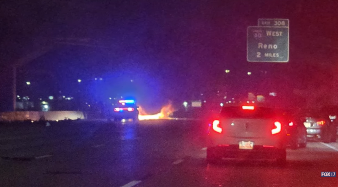 Emergency crews respond as flames from the crash scene are visible in the distance along I-15 northbound, as posted on November 30, 2025 | Source: YouTube/Fox13now