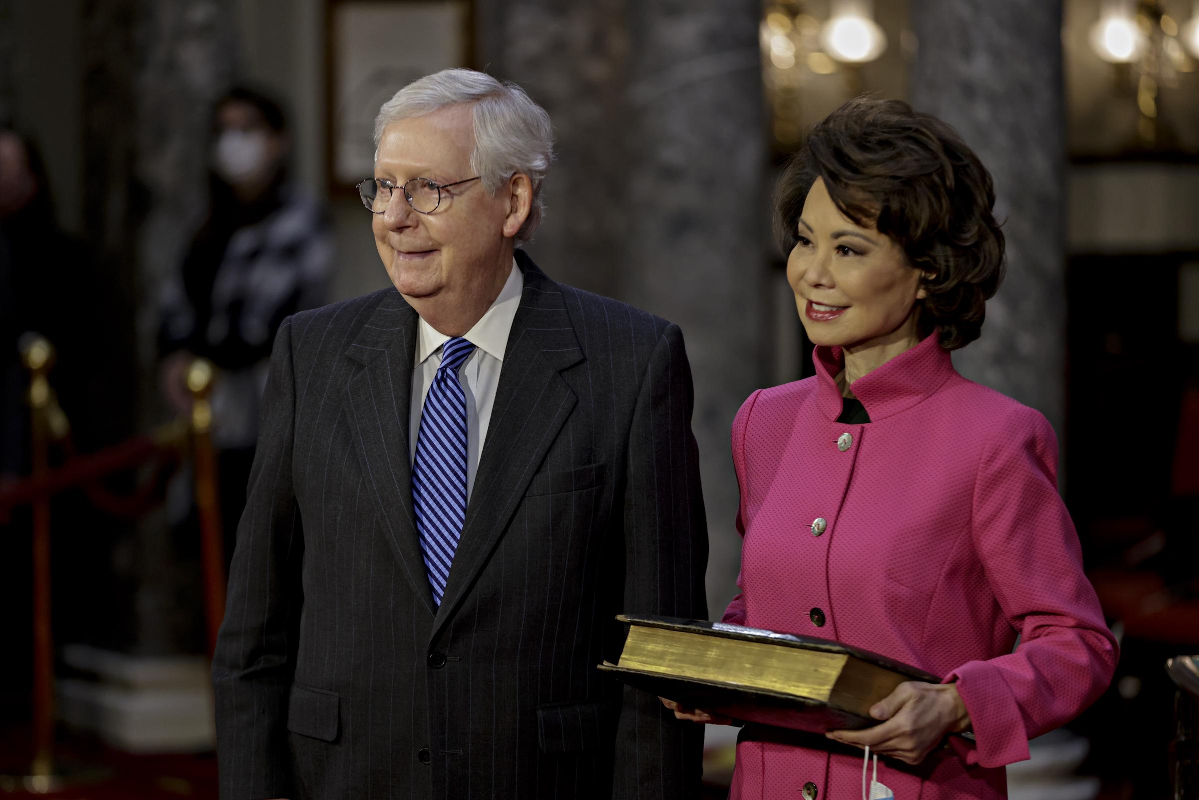 Mitch McConnell waiting to be sworn in during a congress session as Elaine Chao stands beside him in Washington, DC on January 3, 2021. | Source: Getty Images