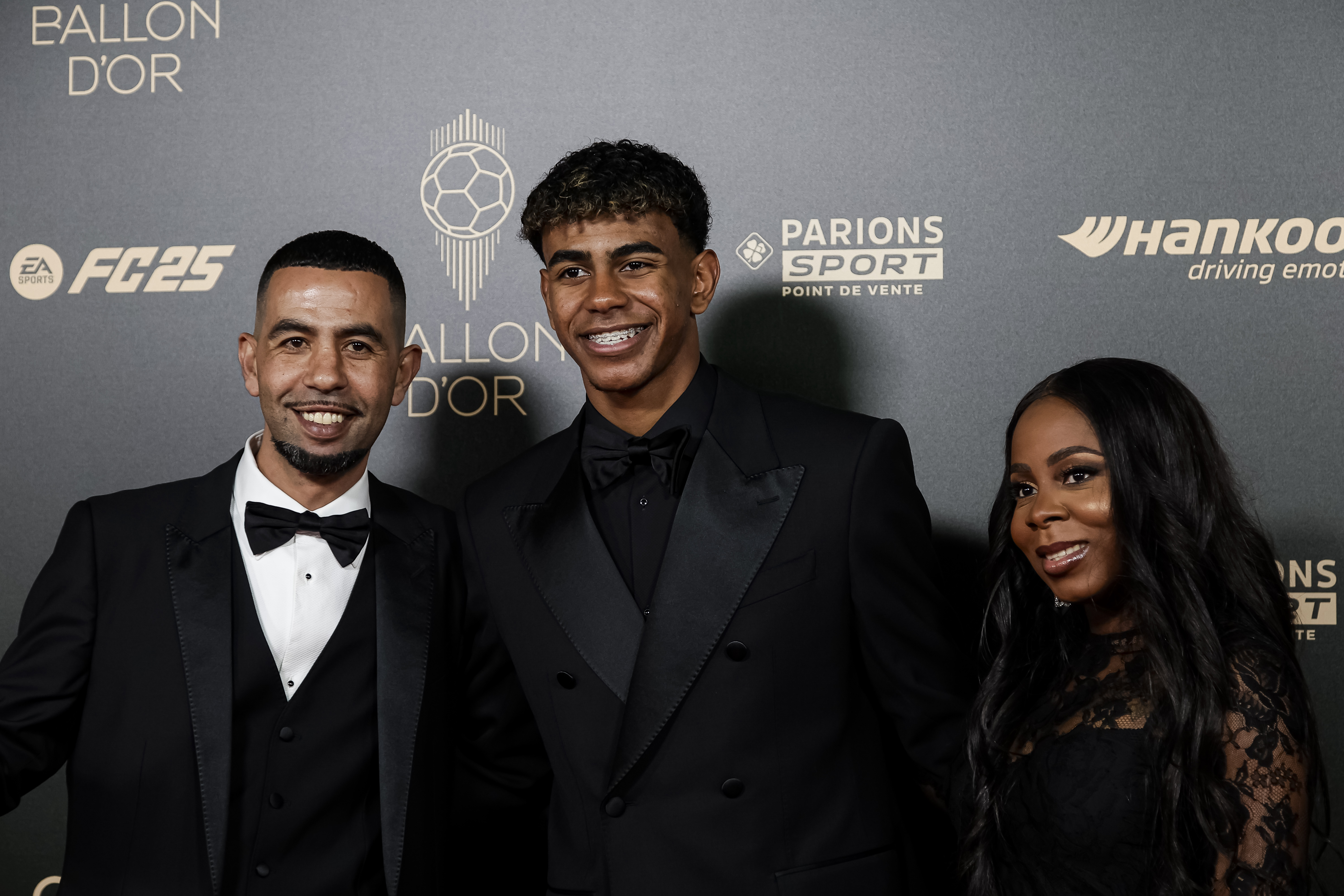 Lamine Yamal poses for photos with his parents prior to the 68th Ballon d'Or Ceremony at Théâtre du Châtelet on October 28, 2024, in Paris, France. | Source: Getty Images