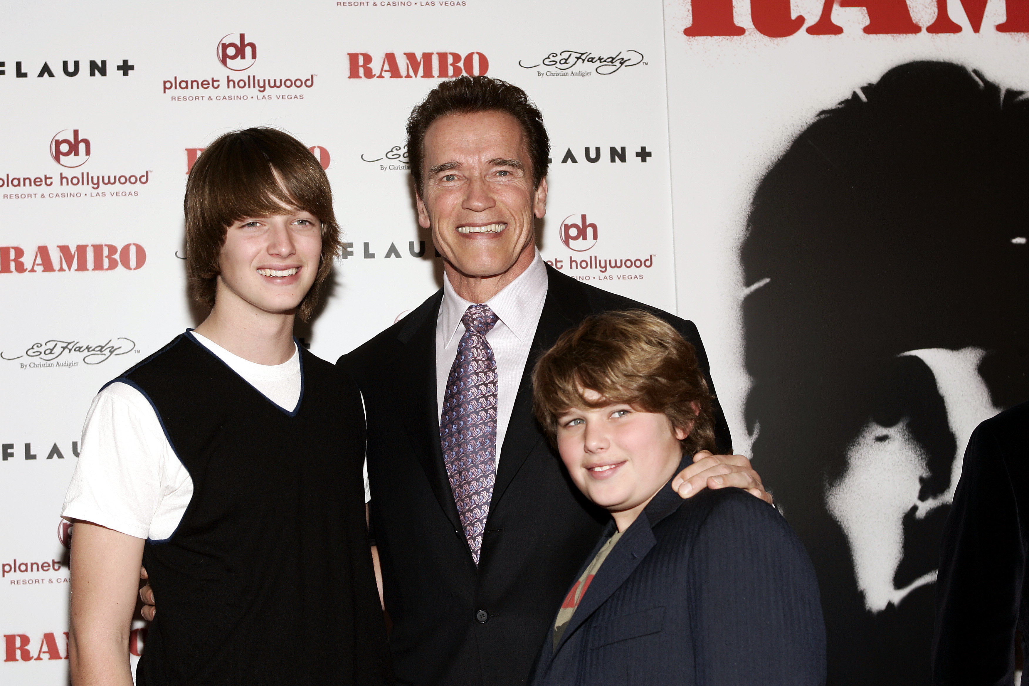 California Governor Arnold Schwarzenegger with Patrick and Christopher at the world premiere of "Rambo" | Source: Getty Images