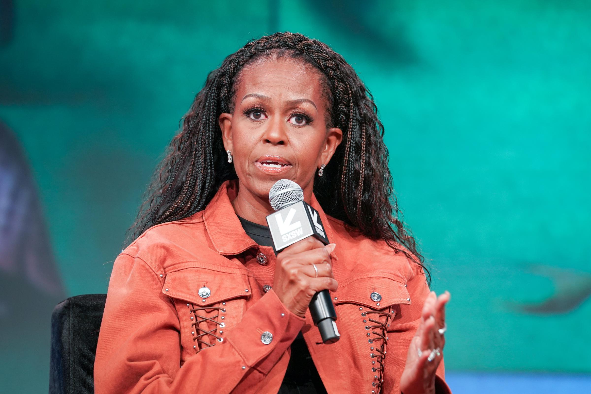 Michelle Obama speaking onstage during a recording of the "IMO with Michelle Obama & Craig Robinson" podcast during the 2025 SXSW Conference And Festival in Austin, Texas on March 13, 2025. | Source: Getty Images