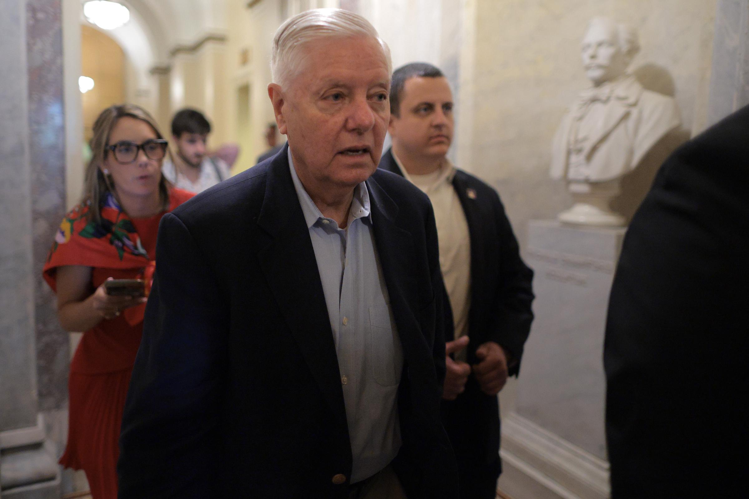 Lindsey Graham strides through the Capitol on his way to a Senate vote, moving with purpose as lawmakers prepare to debate major Republican legislative priorities. | Source: Getty Images