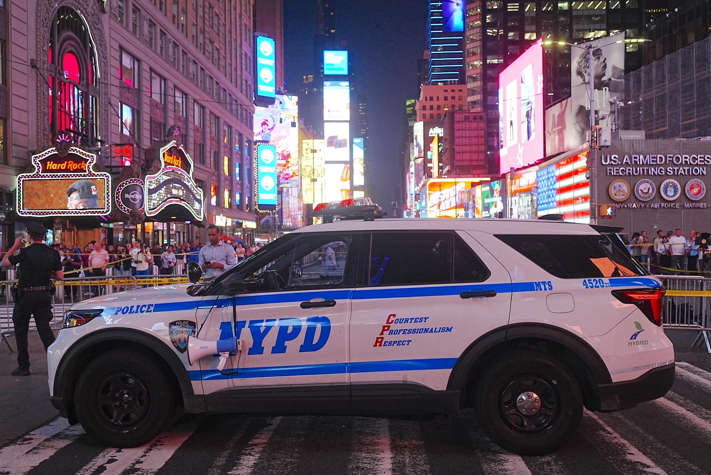 NYPD officers secured the Times Square scene after confronting the woman accused of stabbing Piacenti and a 68-year-old man. Authorities later said the attack appeared to have been random and unprovoked, with no indication of terrorism. | Source: Getty Images