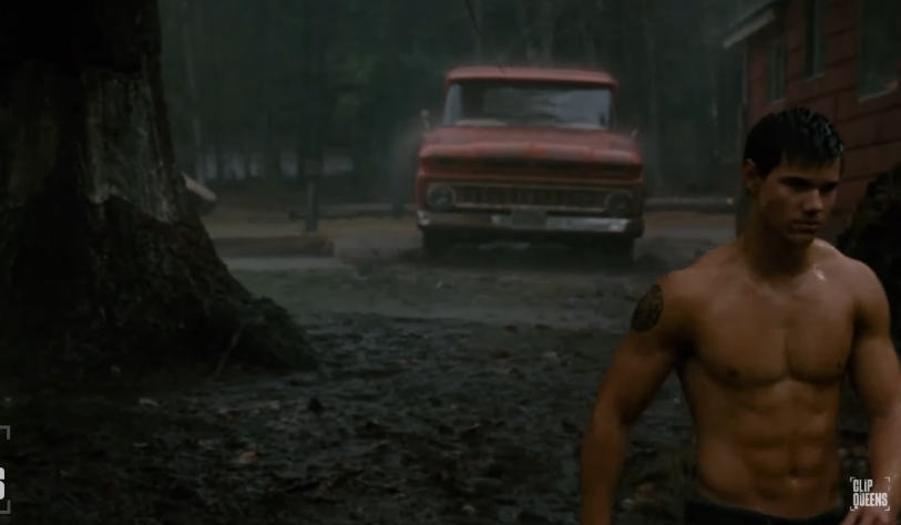 Taylor Lautner displayed the muscular build he developed for Jacob Black while appearing shirtless during a rain-soaked scene. | Source: YouTube/Clip Queens