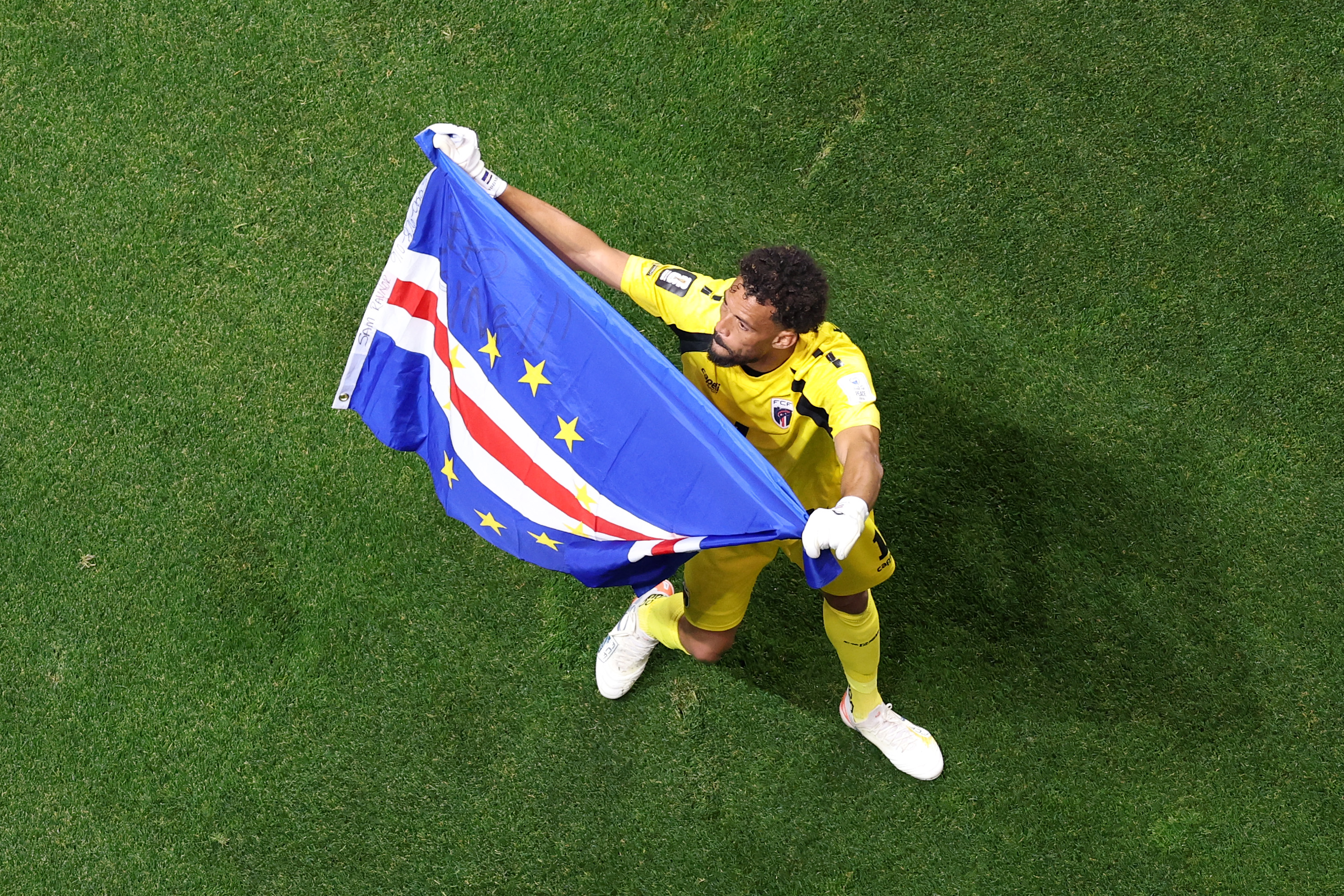 Vozinha waves the Cape Verde flag after the 0-0 draw during the FIFA World Cup 2026 Group H match between Spain and Cape Verde at Atlanta Stadium on June 15 in Georgia. | Source: Getty Images