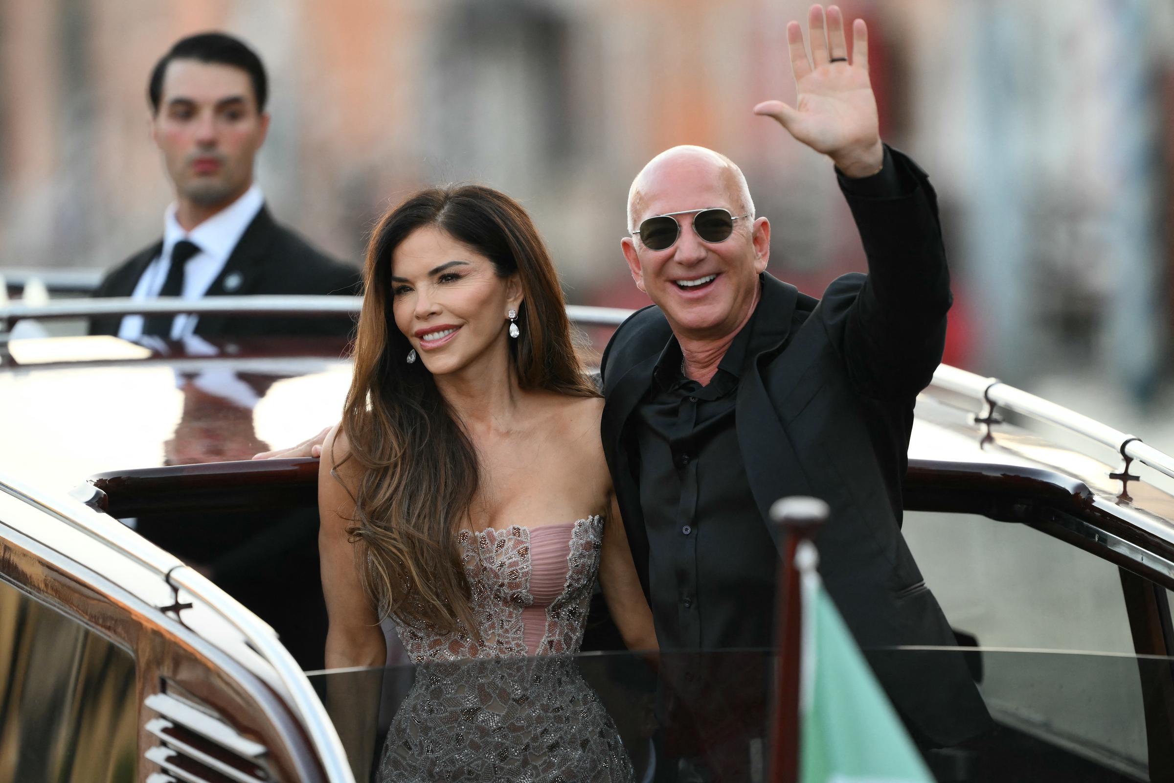 The newlyweds, Lauren Sánchez and Jeff Bezos, seen leaving the Aman Hotel and greeting the crowd on June 28, 2025, in Venice | Source: Getty Images