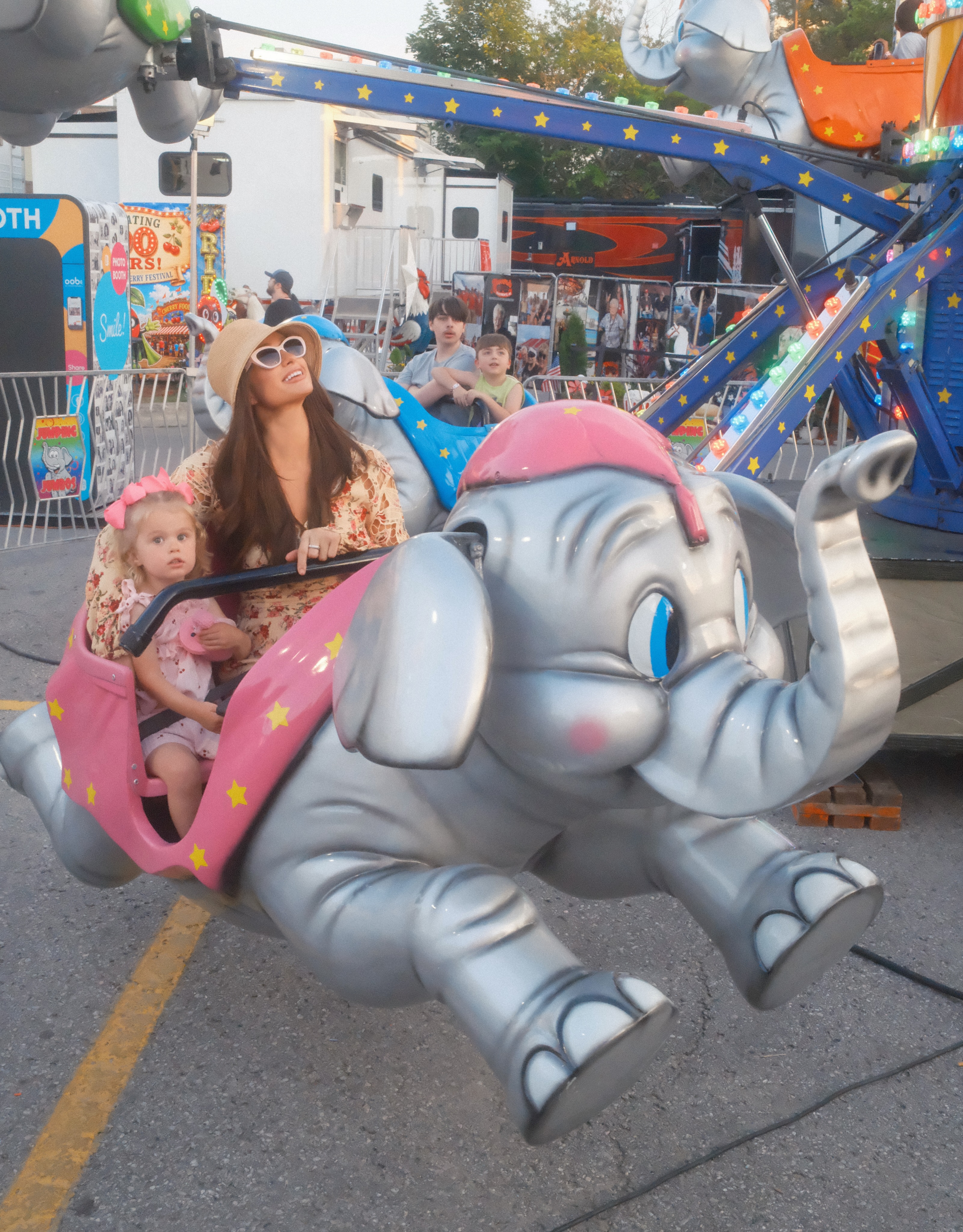 Paris joined London for one of the festival rides as part of the family's activity-filled visit. The star said nothing compared with seeing her children smile, laugh, and make new memories. | Source: Instagram/parishilton