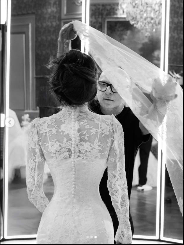 Lauren Sánchez being assisted with her veil on her wedding day, from a post dated June 27, 2025. | Source: Instagram/laurensanchezbezos