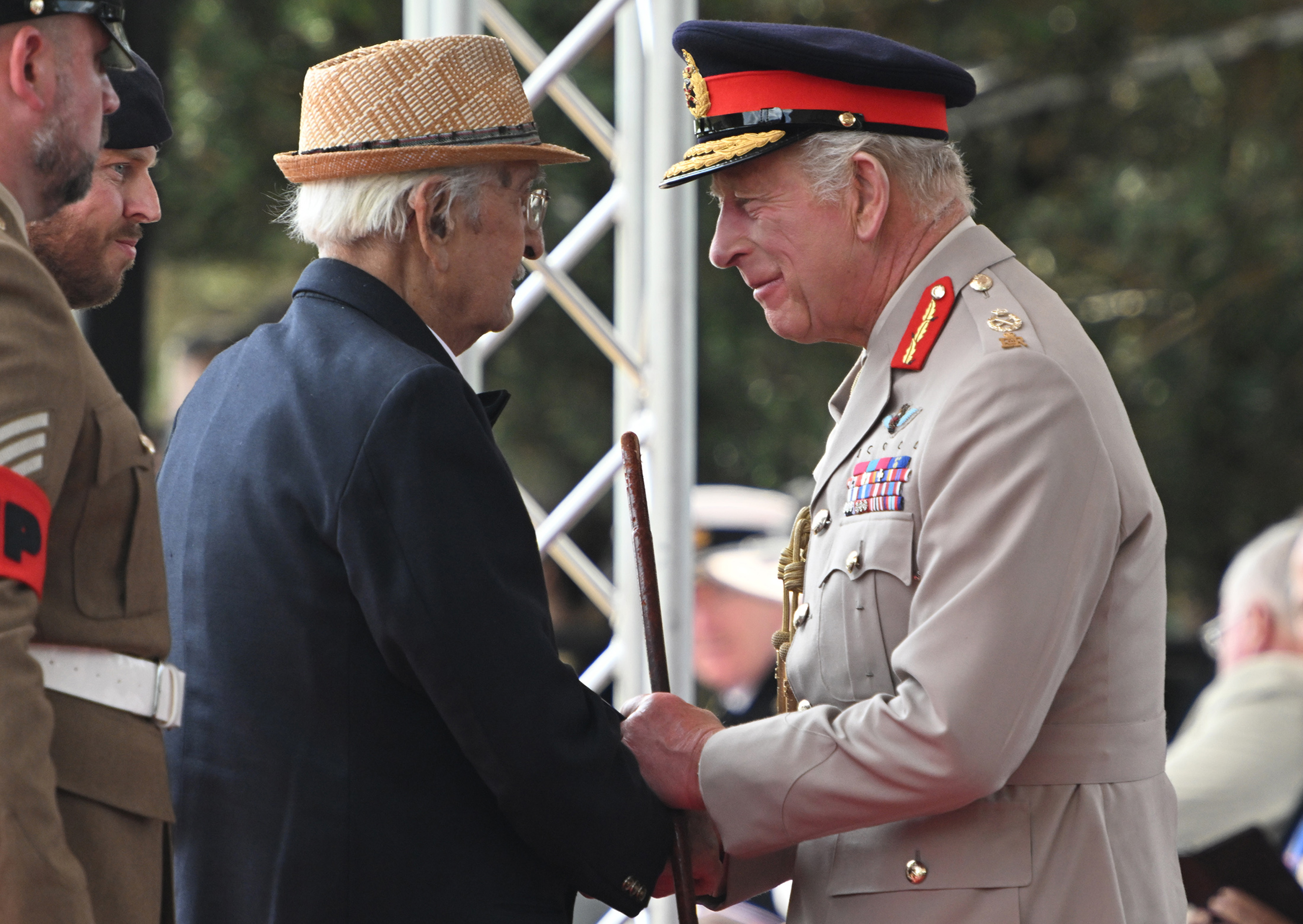 King Charles III and Yavar Abbas during a Service of Remembrance to commemorate the 80th Anniversary of VJ Day at The National Memorial Arboretum on August 15, 2025, in Alrewas, Staffordshire | Source: Getty Images
