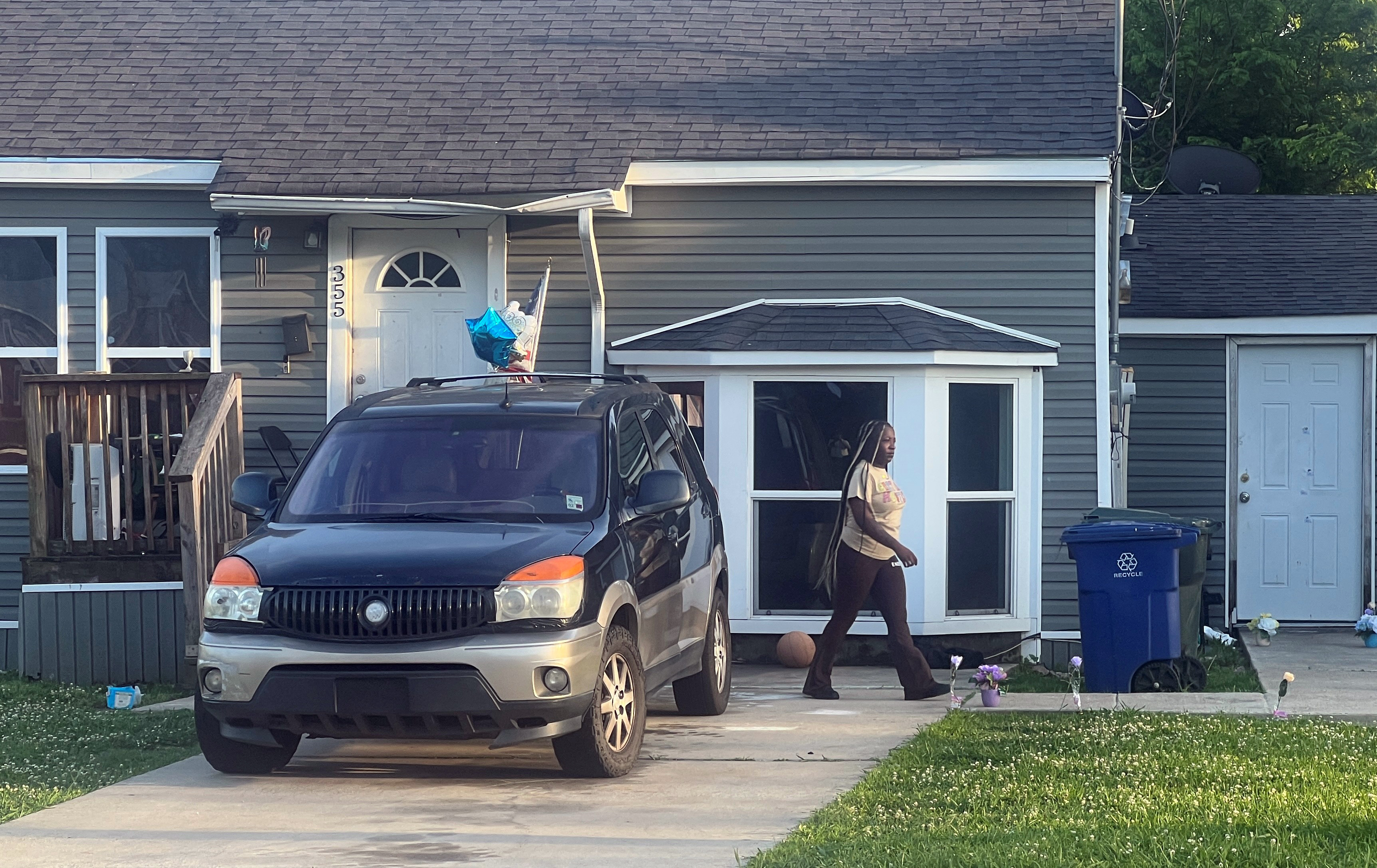 A woman is seen outside the house where a mass shooting took place in Shreveport, Louisiana, on April 19, 2026. | Source: Getty Images