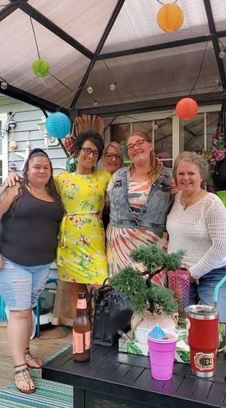 Lora Roberts, 37, pictured at far left, enjoys a gathering with four friends. The mother of five was tragically killed in the October 9 Erie massacre while reportedly trying to rescue her niece from an abusive man. | Source: Facebook/maryann.lewis3