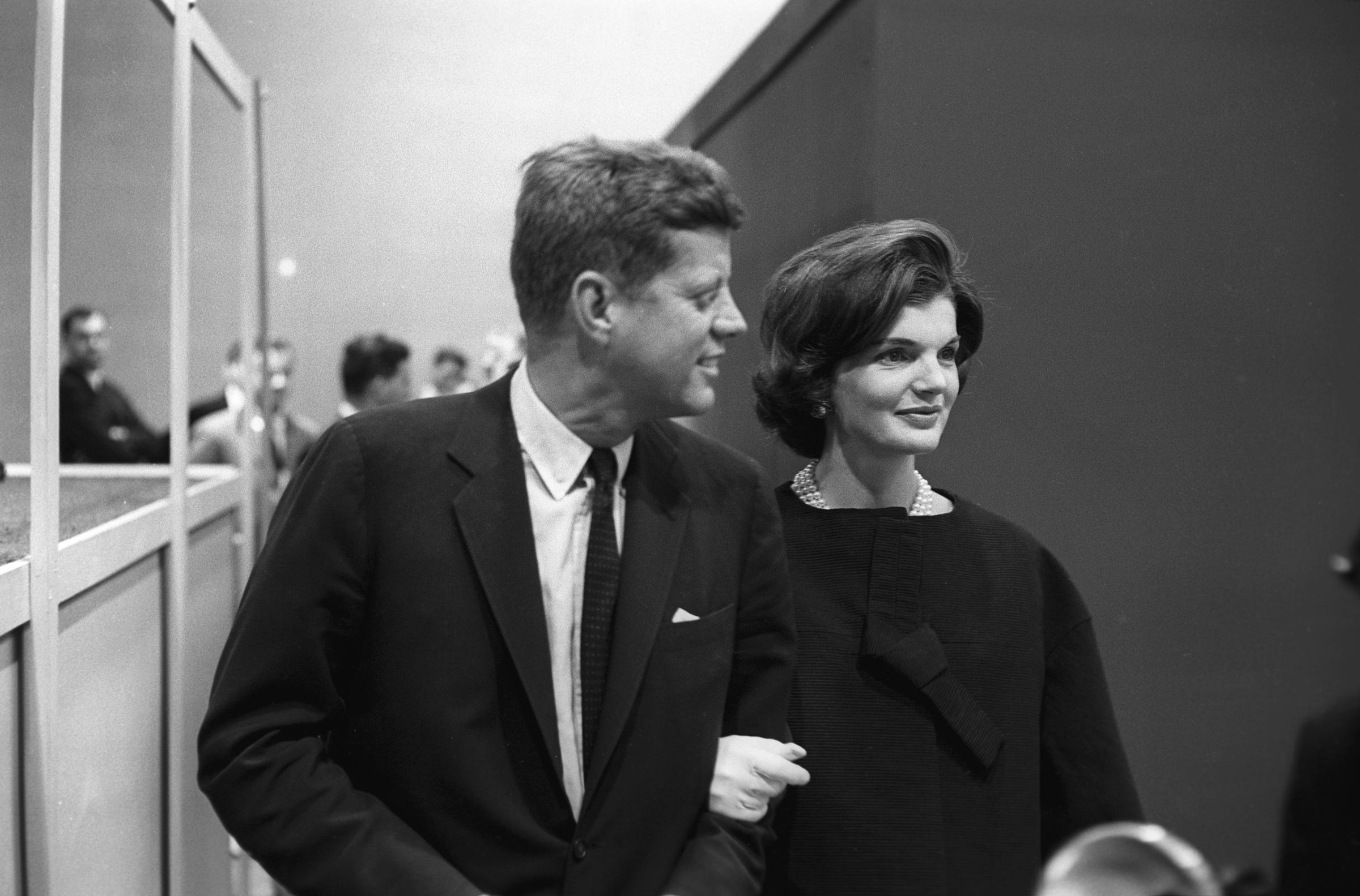 John F. Kennedy and Jacqueline Kennedy Onassis at the split-screen telecast of the Presidential debate with Richard Nixon and panelists in ABC Studios in New York on October 13, 1960. | Source: Getty Images