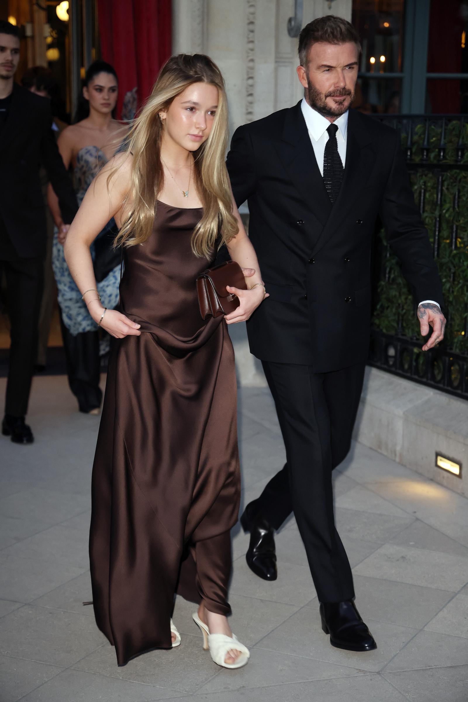 Harper and David Beckham leaving their hotel to head to the Victoria Beckham show during the womenswear Fall/Winter 2025/2026 as part of Paris Fashion Week on March 7, 2025, in France. | Source: Getty Images