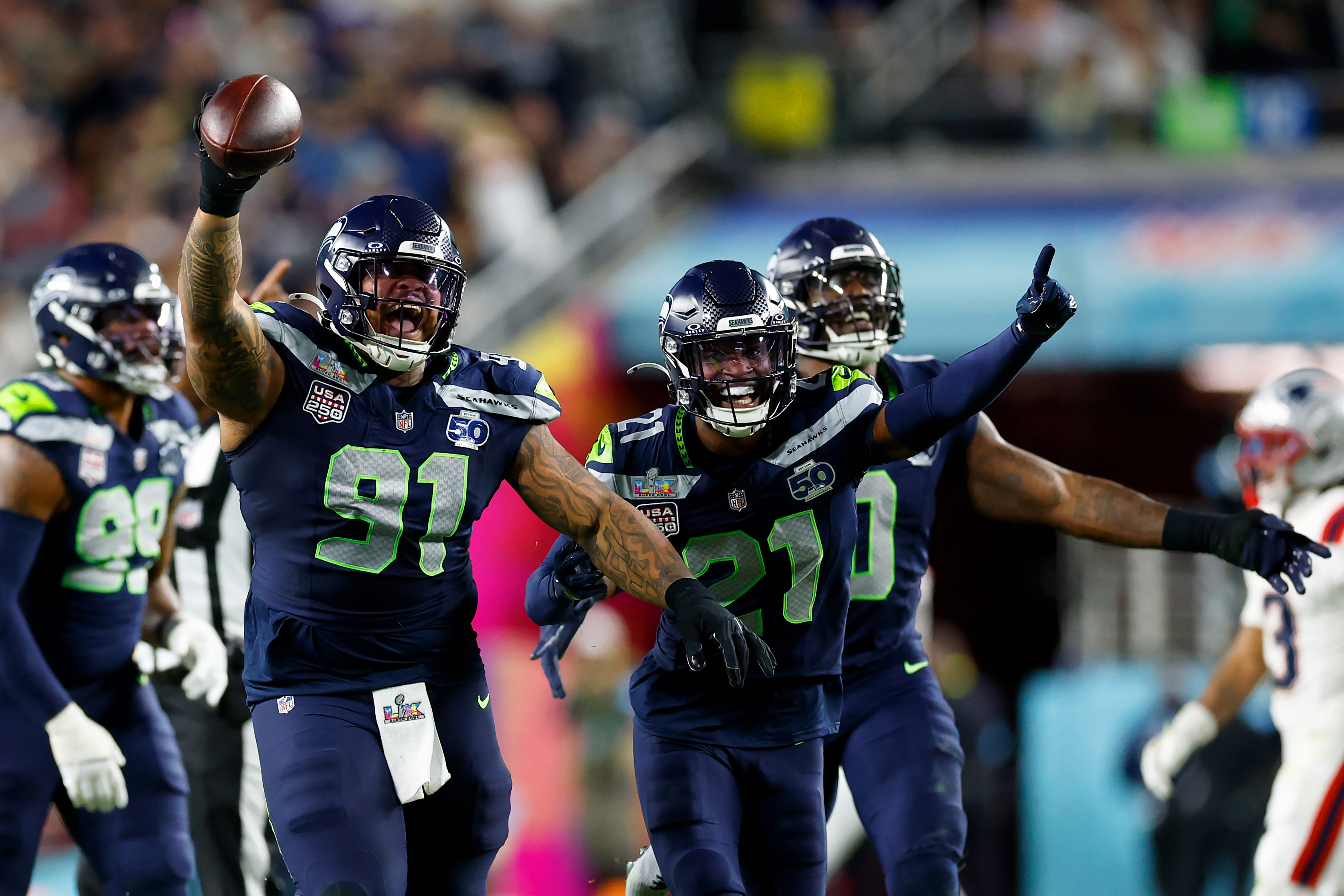 Byron Murphy II and Devon Witherspoon celebrate after Murphy recovered a fumble during Super Bowl LX at Levi's Stadium on February 8, 2026, in Santa Clara, California | Source: Getty Images