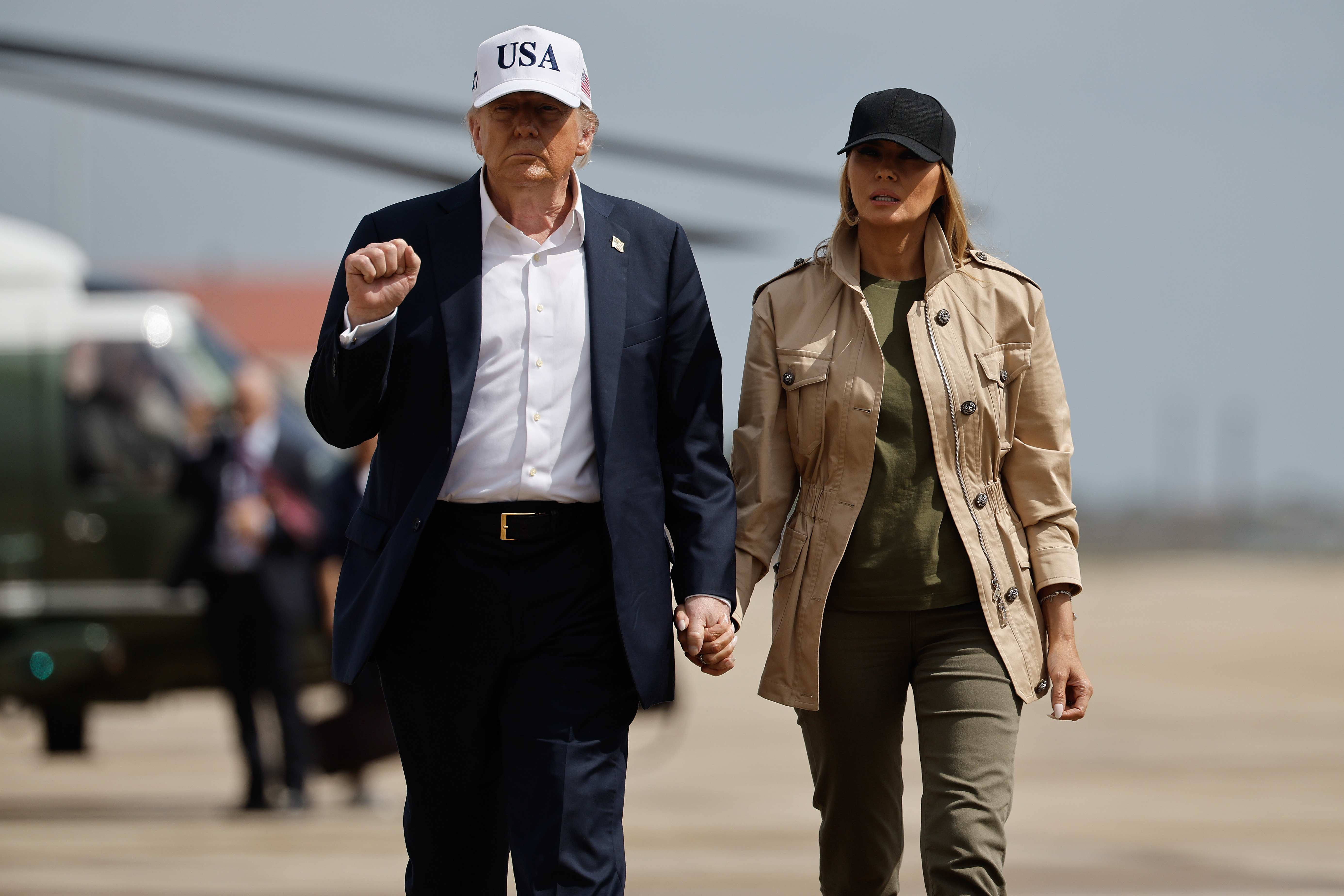 President Donald Trump and first lady Melania Trump walk across the tarmac at Lackland Air Force Base on July 11, 2025, in San Antonio, Texas | Source: Getty Images