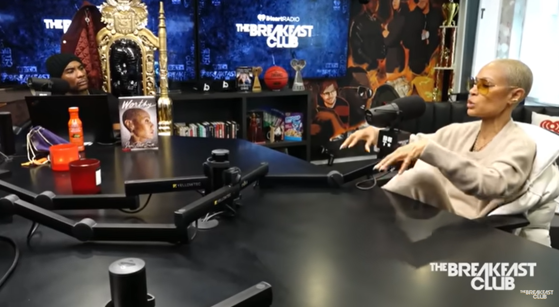 Jada Pinkett Smith speaks across from co-host Charlamagne Tha God during her interview on The Breakfast Club. | Source: YouTube/BreakfastClubPower1051FM