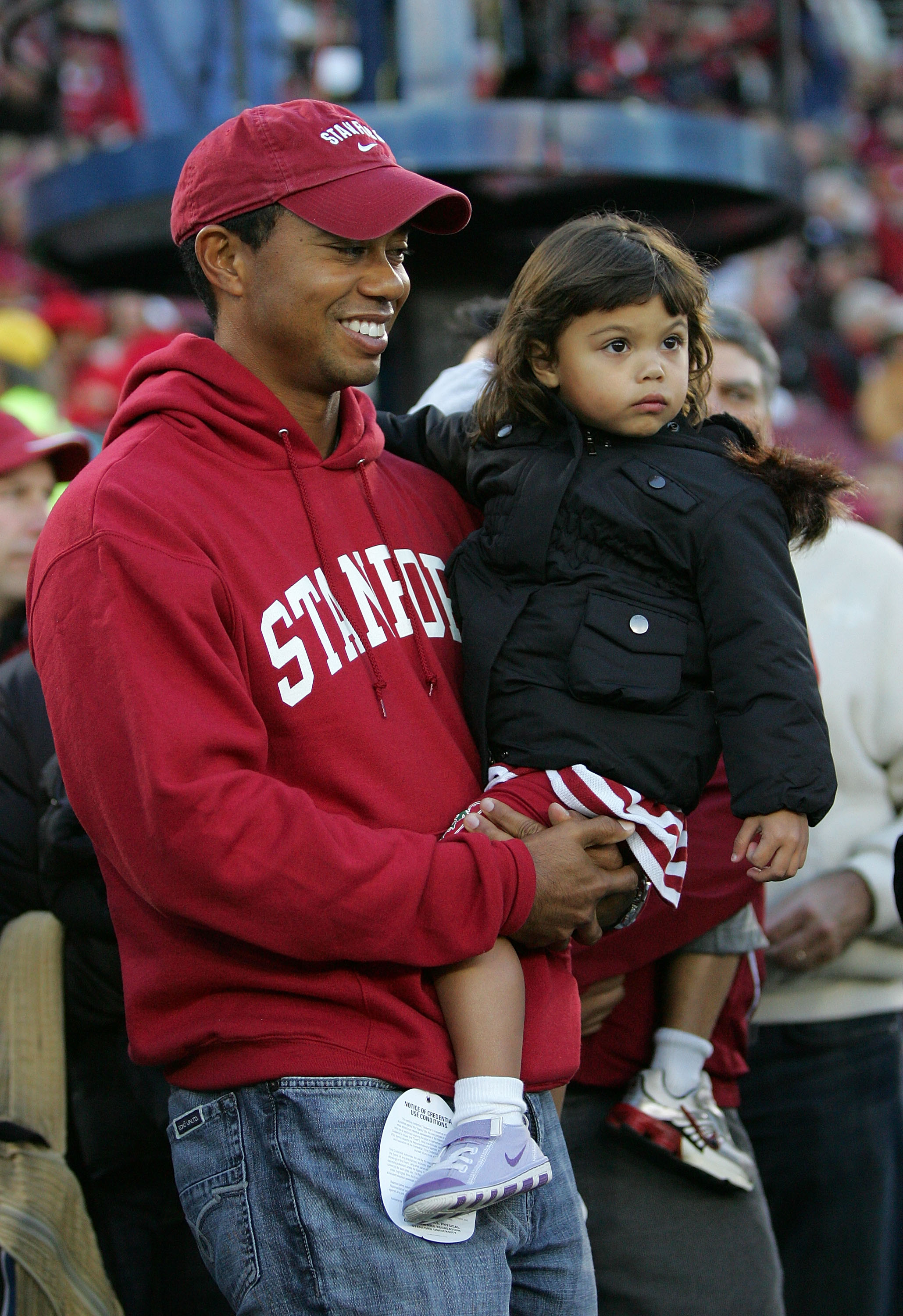 Tiger Woods holds Sam Woods on the sidelines before the Stanford Cardinal game against the California Bears at Stanford Stadium on November 21, 2009, in Palo Alto, California | Source: Getty Images