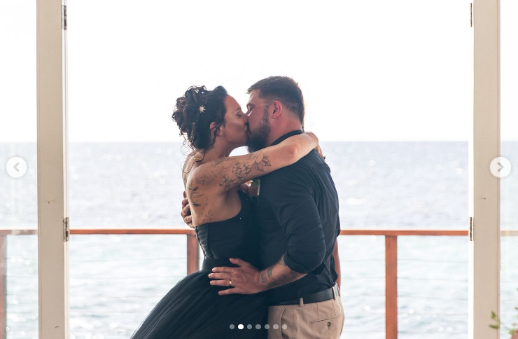 Sarah and Luke Wintrip on their wedding day in Ocho Rios, Jamaica, in a post dated May 23, 2025 | Source: Instagram/lipsticknlouboutins | lukewintriptattooartist
