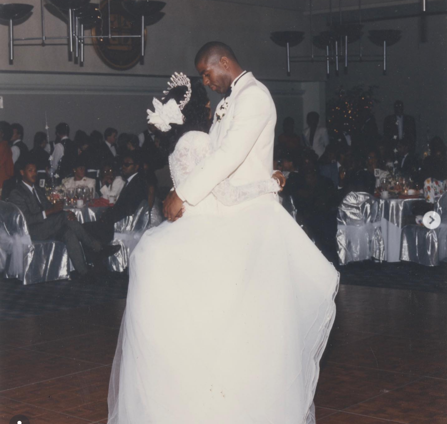 Magic Johnson and Cookie Johnson sharing a dance at their wedding reception in a throwback photo celebrating three decades of marriage. | Source: Instagram/magicjohnson