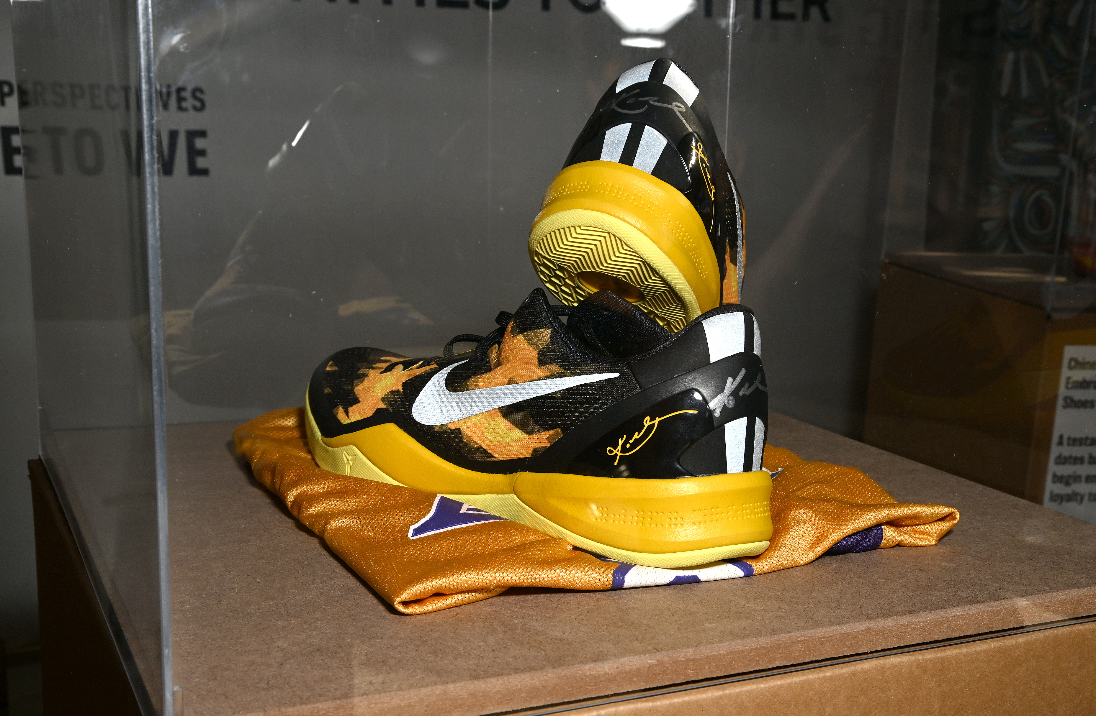 Basketball shoes autographed by Kobe Bryant on display at the official launch event and series premiere of "A Mile In These Shoes" at COMUNITYmade in Los Angeles, California, on July 28, 2022. | Source: Getty Images